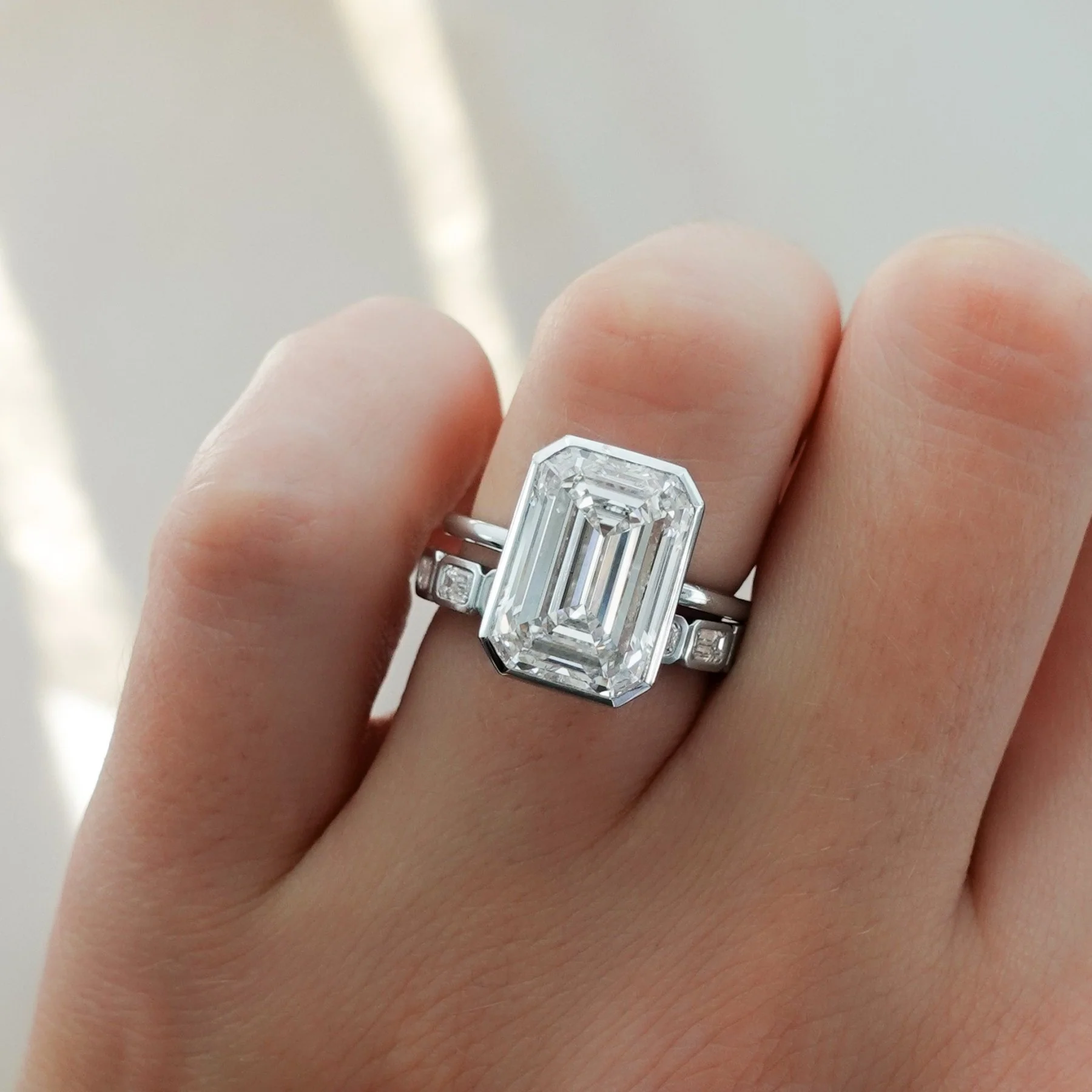 Penumbra Bezel Set Engagement Ring With Emerald Cut - Image 11