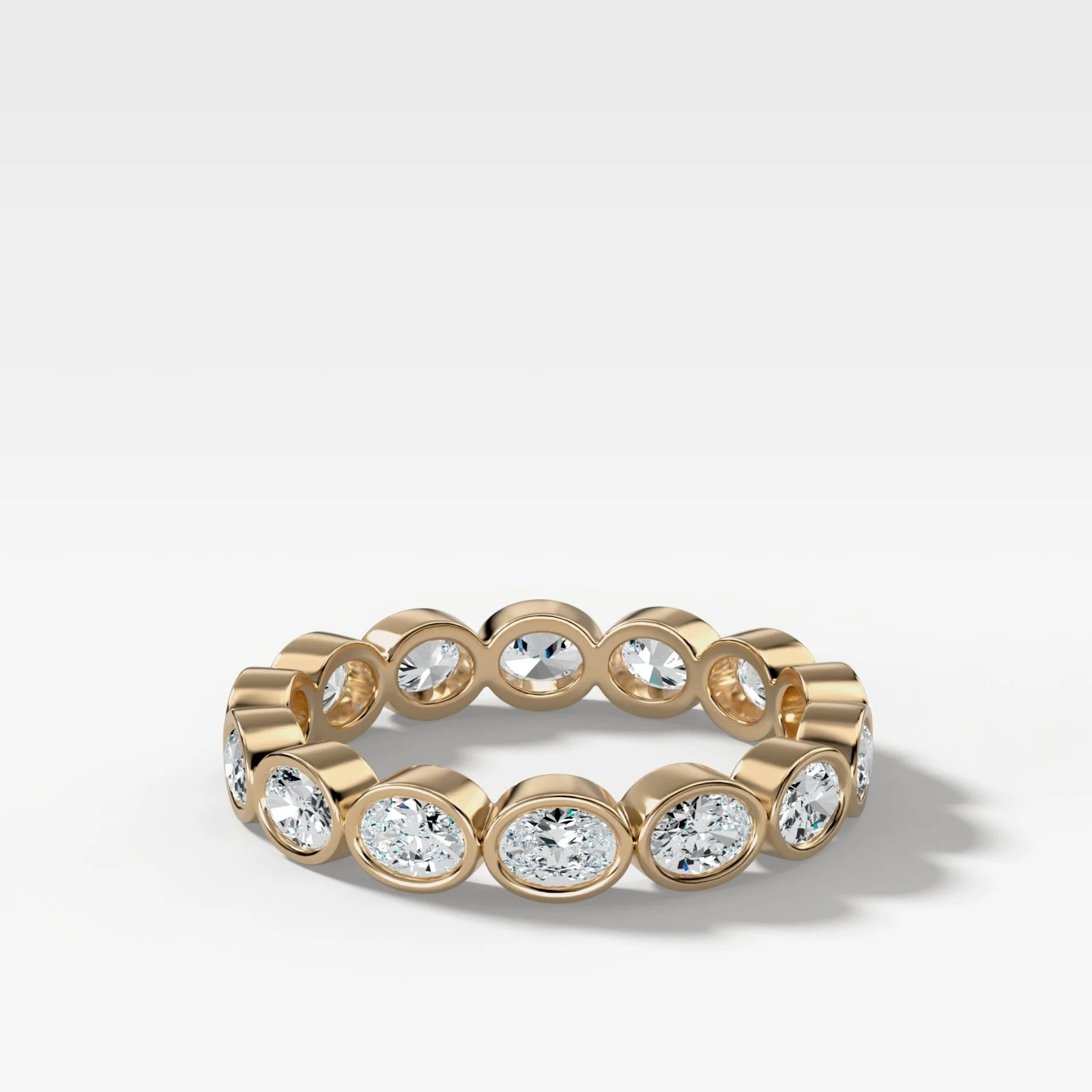 Baby Bezel Set Eternity Band With East West Oval Cuts