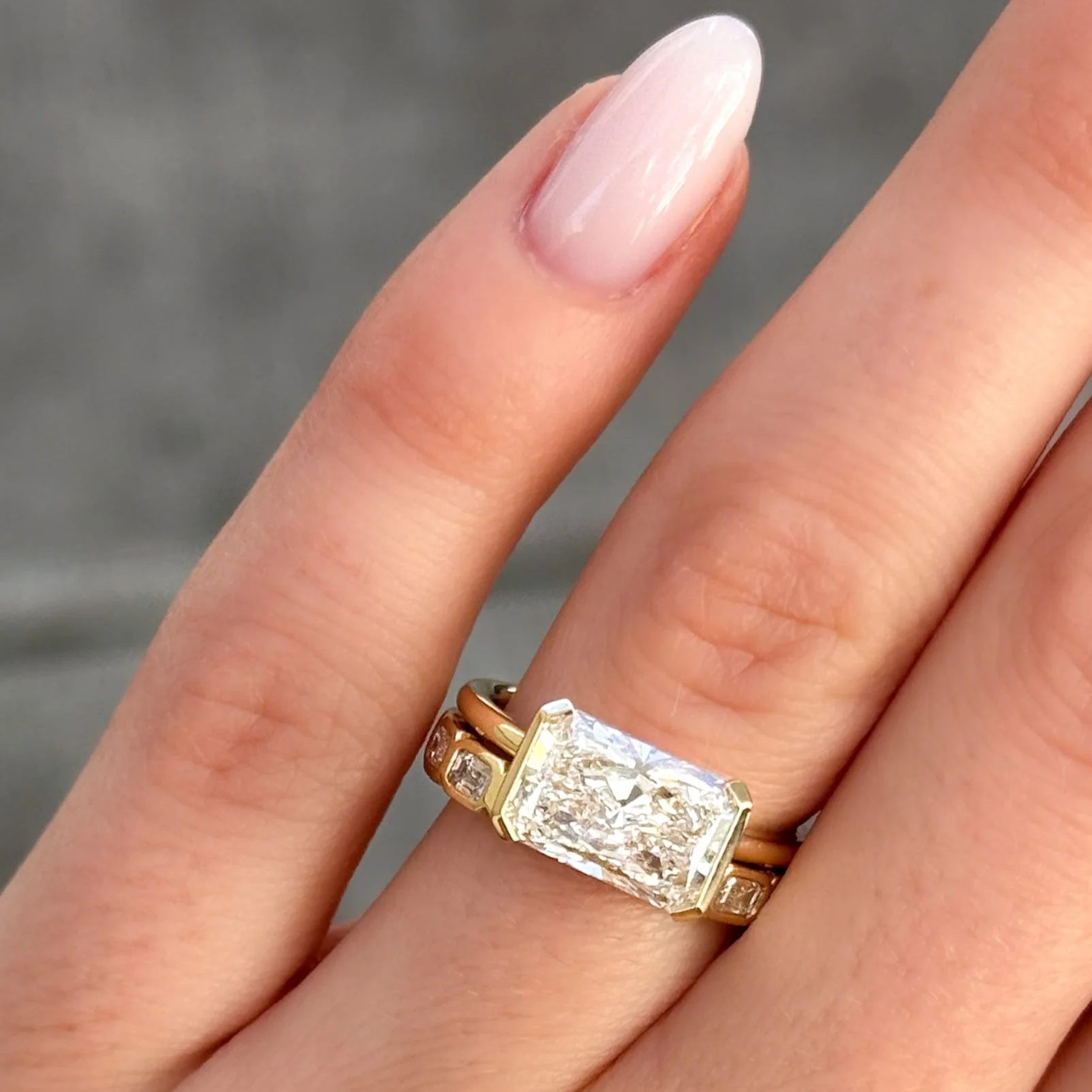 Baby Bezel Set Eternity Band With East West Emerald Cuts - Image 2