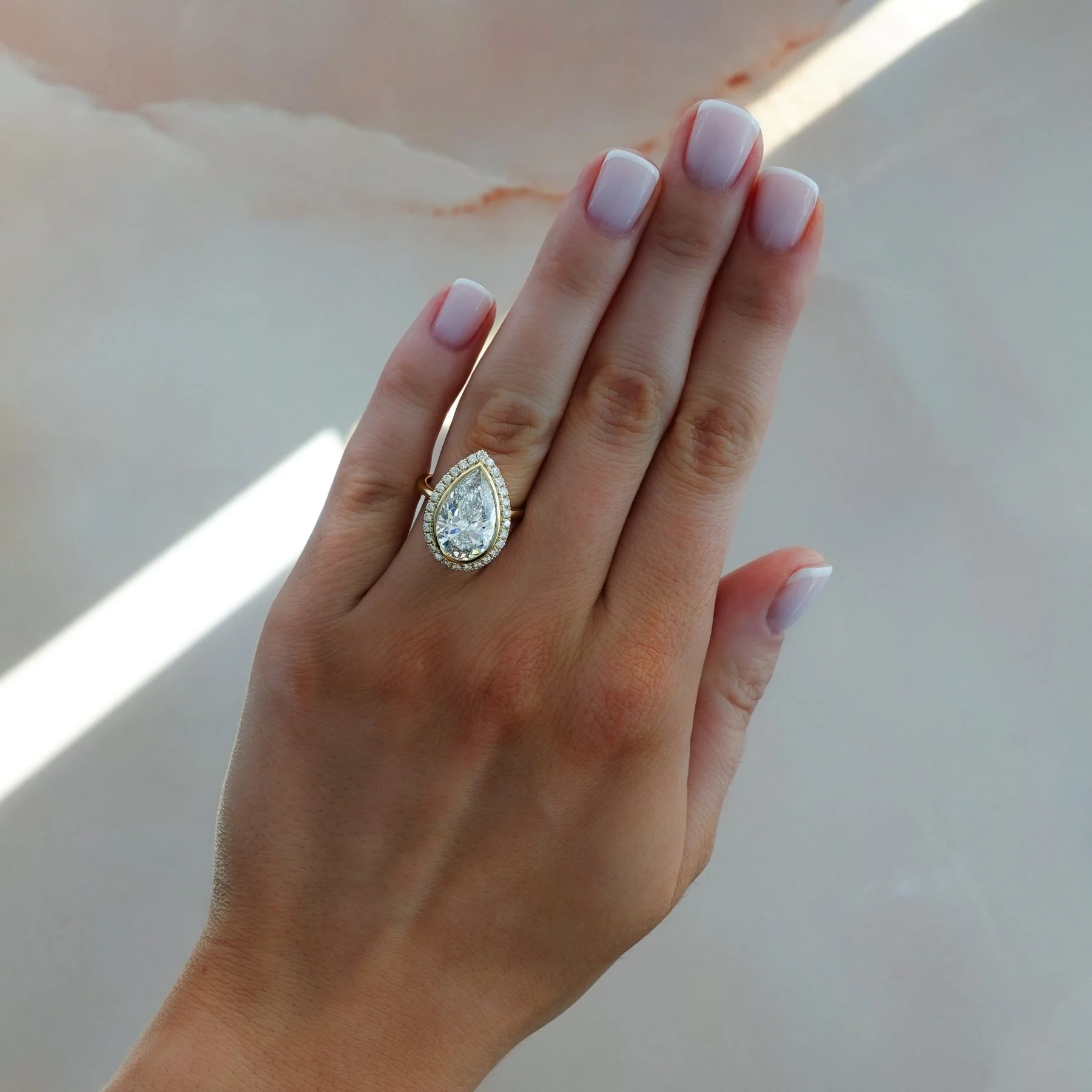 Bezel Set Halo Engagement Ring With Pear Cut Diamond - Image 3