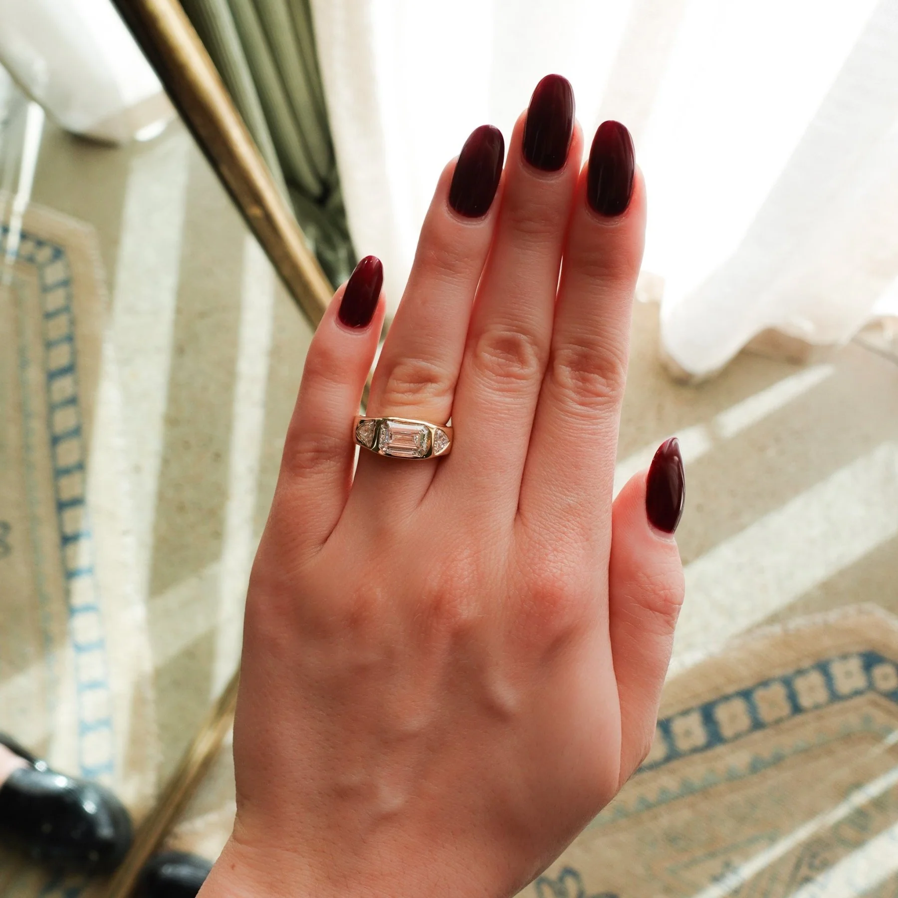 Burnished Three Stone Engagement Ring with Trilliant Sides and East West 2.53ct Lab Grown Emerald Cut Diamond - Image 5