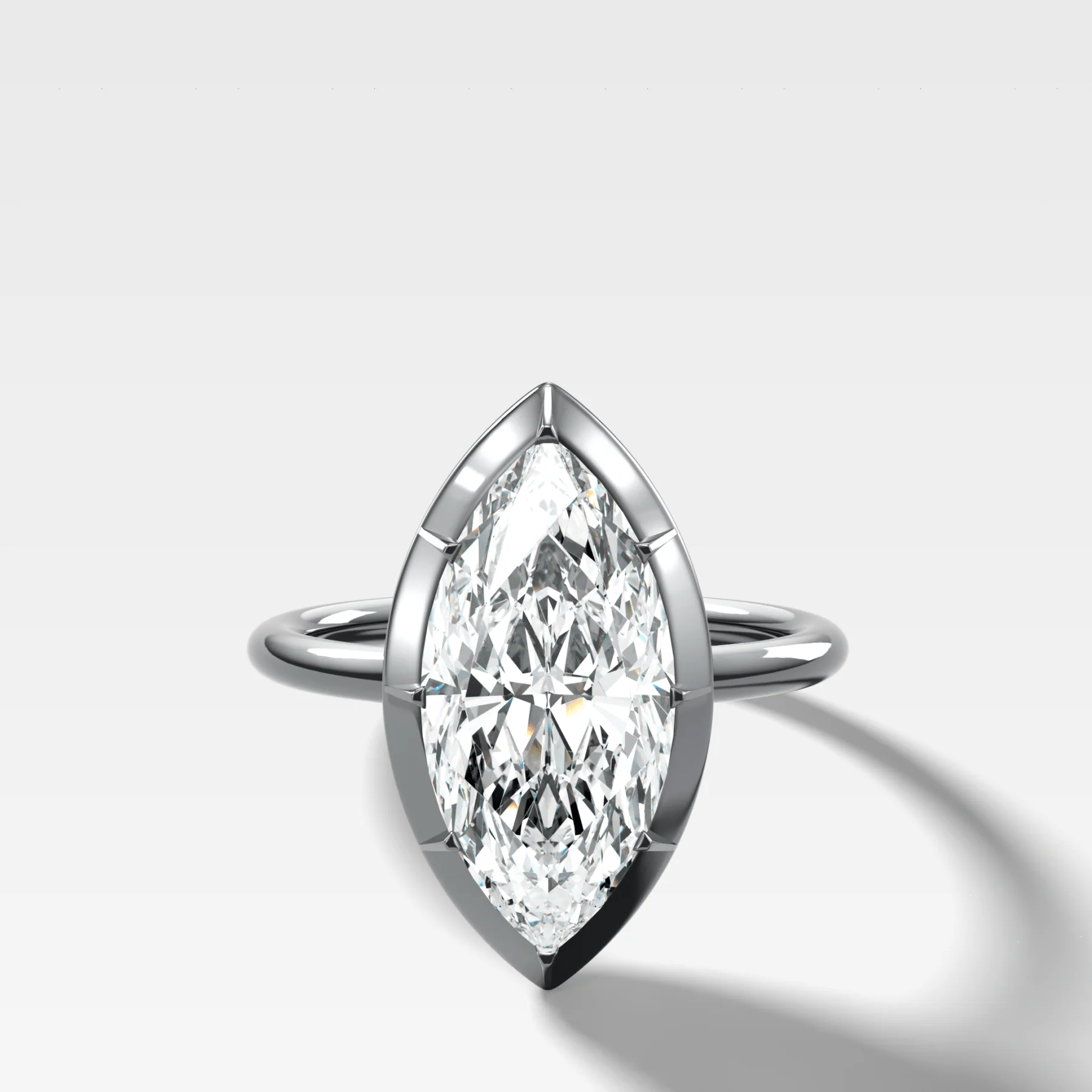 Button Back Solitaire Engagement Ring With a Marquise Cut Diamond - Image 3