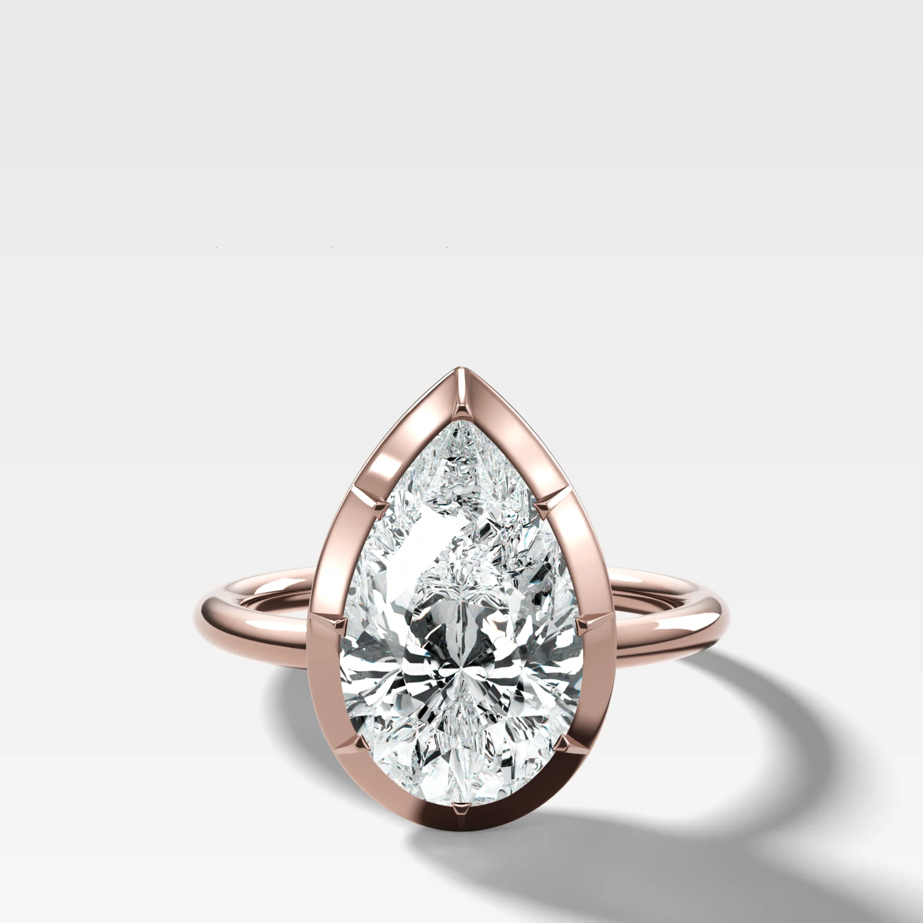 Button Back Solitaire Engagement Ring With a Pear Cut Diamond - Image 4