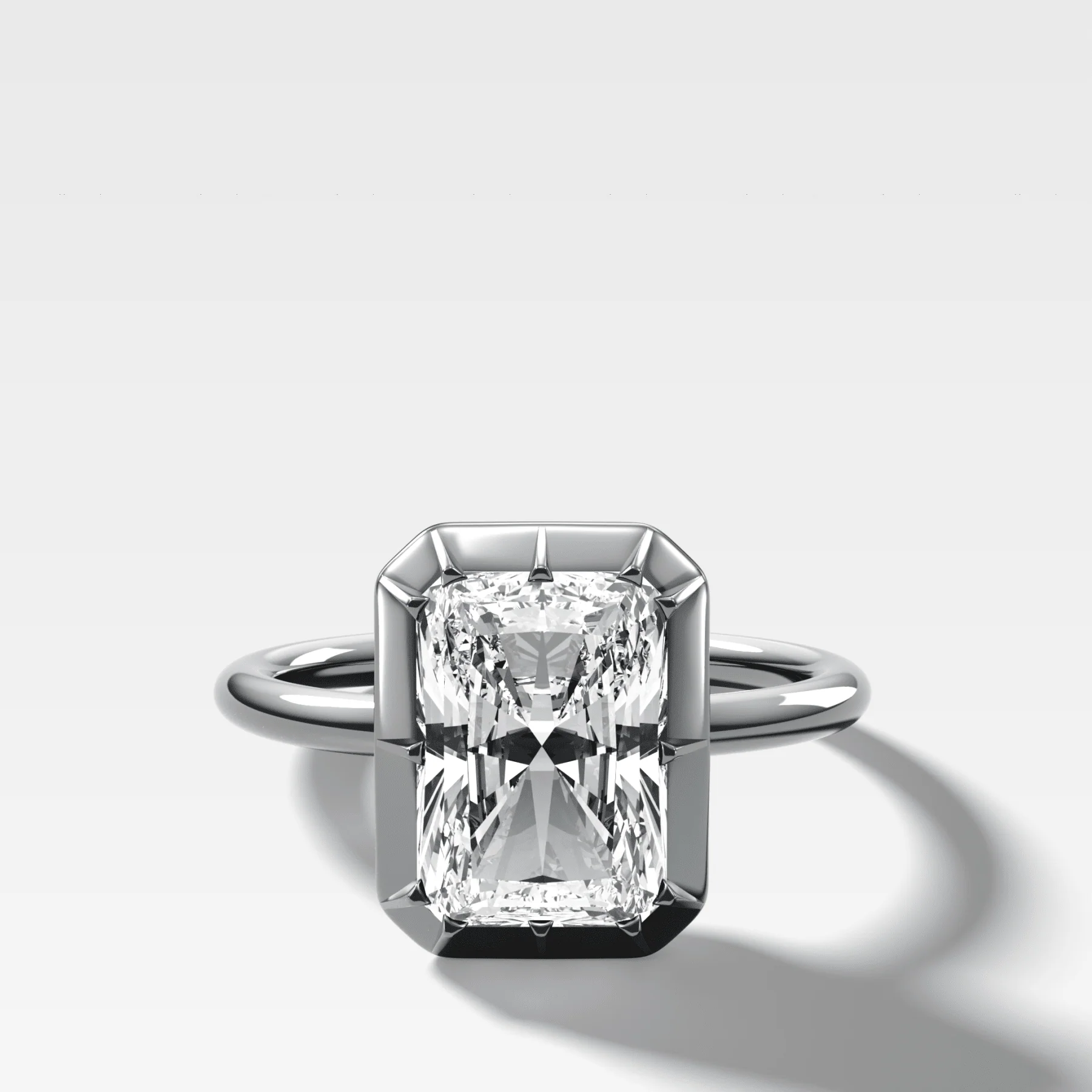 Button Back Solitaire Engagement Ring With an Elongated Radiant Cut Diamond - Image 3