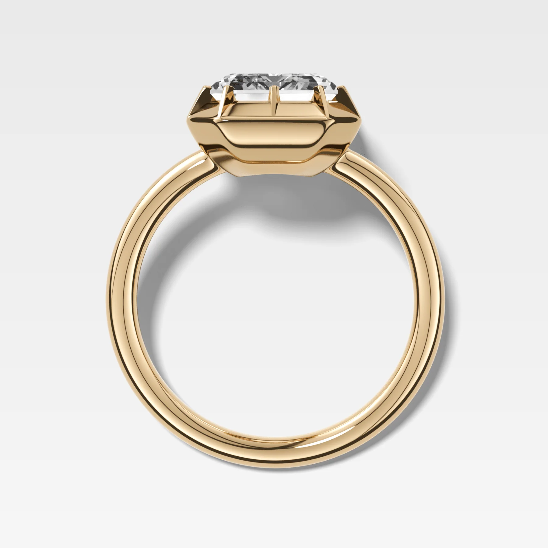 Button Back Solitaire Engagement Ring With an Emerald Cut Diamond - Image 2