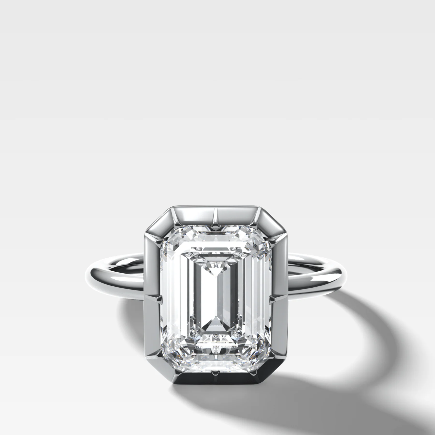 Button Back Solitaire Engagement Ring With an Emerald Cut Diamond - Image 3