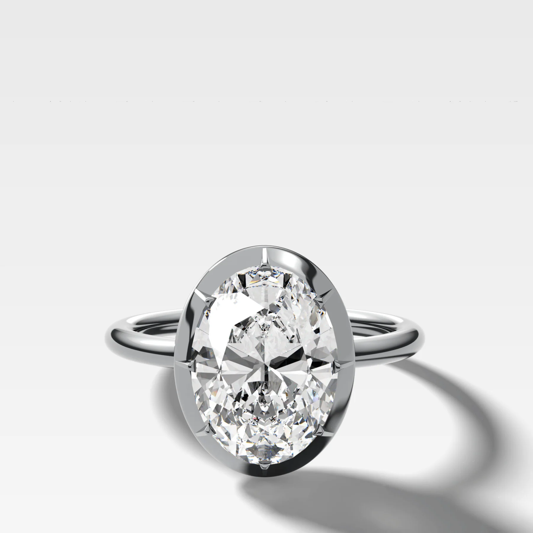 Button Back Solitaire Engagement Ring With an Oval Cut Diamond - Image 3