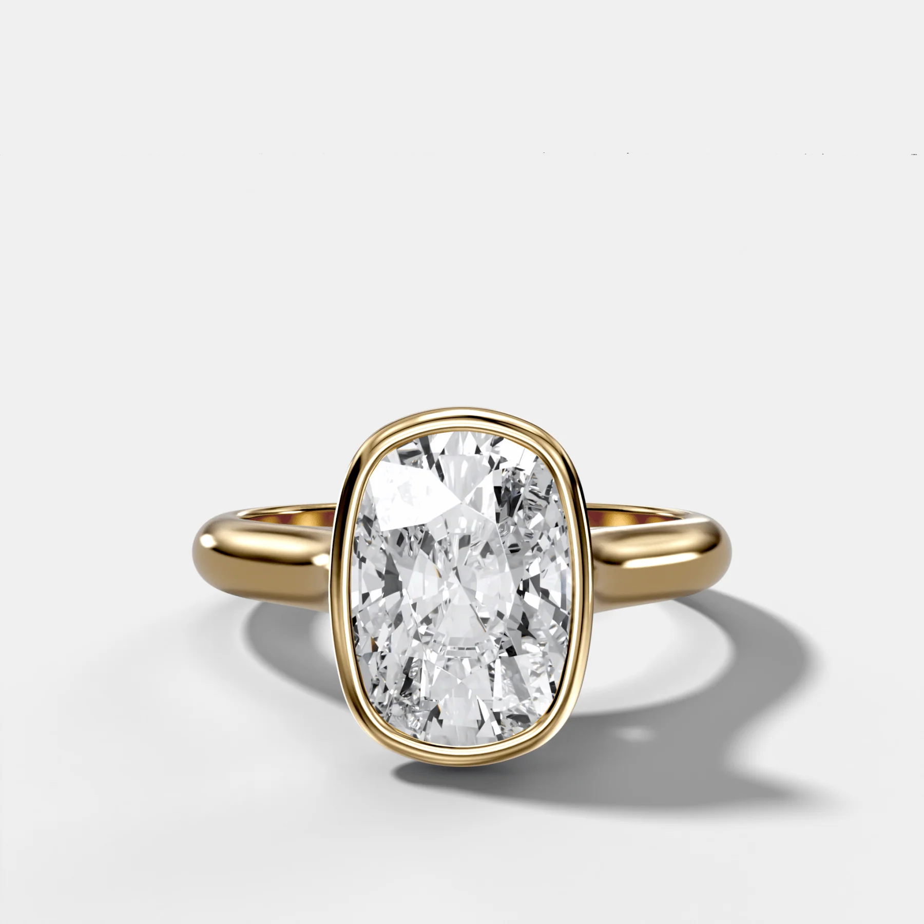 Cathedral Bezel Set Solitaire Engagement Ring With Elongated Cushion Diamond