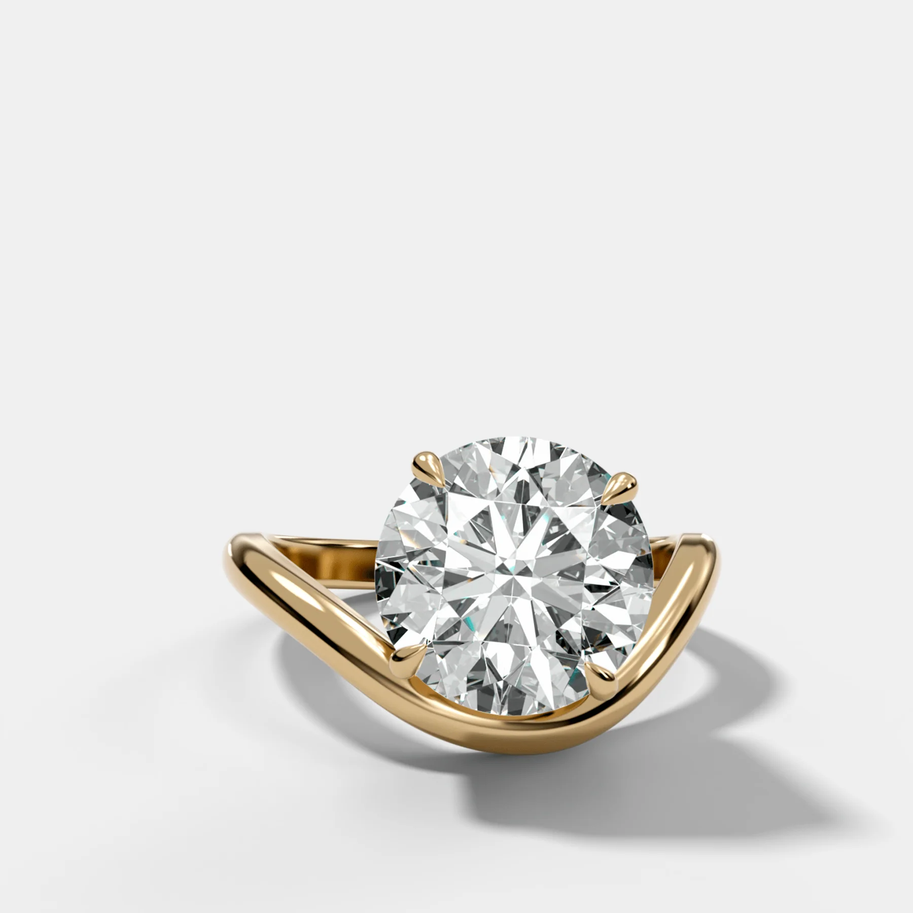 Contoured Engagement Ring with a Round Cut Diamond