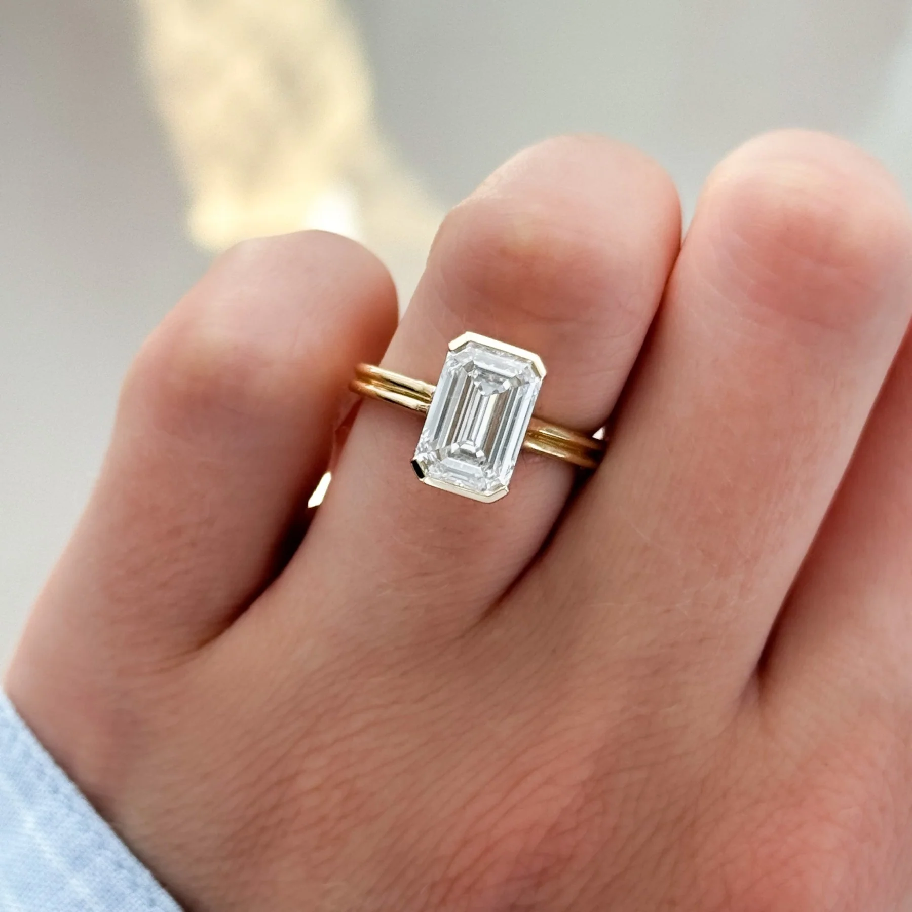 Double Row Half Bezel Solitaire Engagement Ring With Emerald Cut Diamond - Image 3