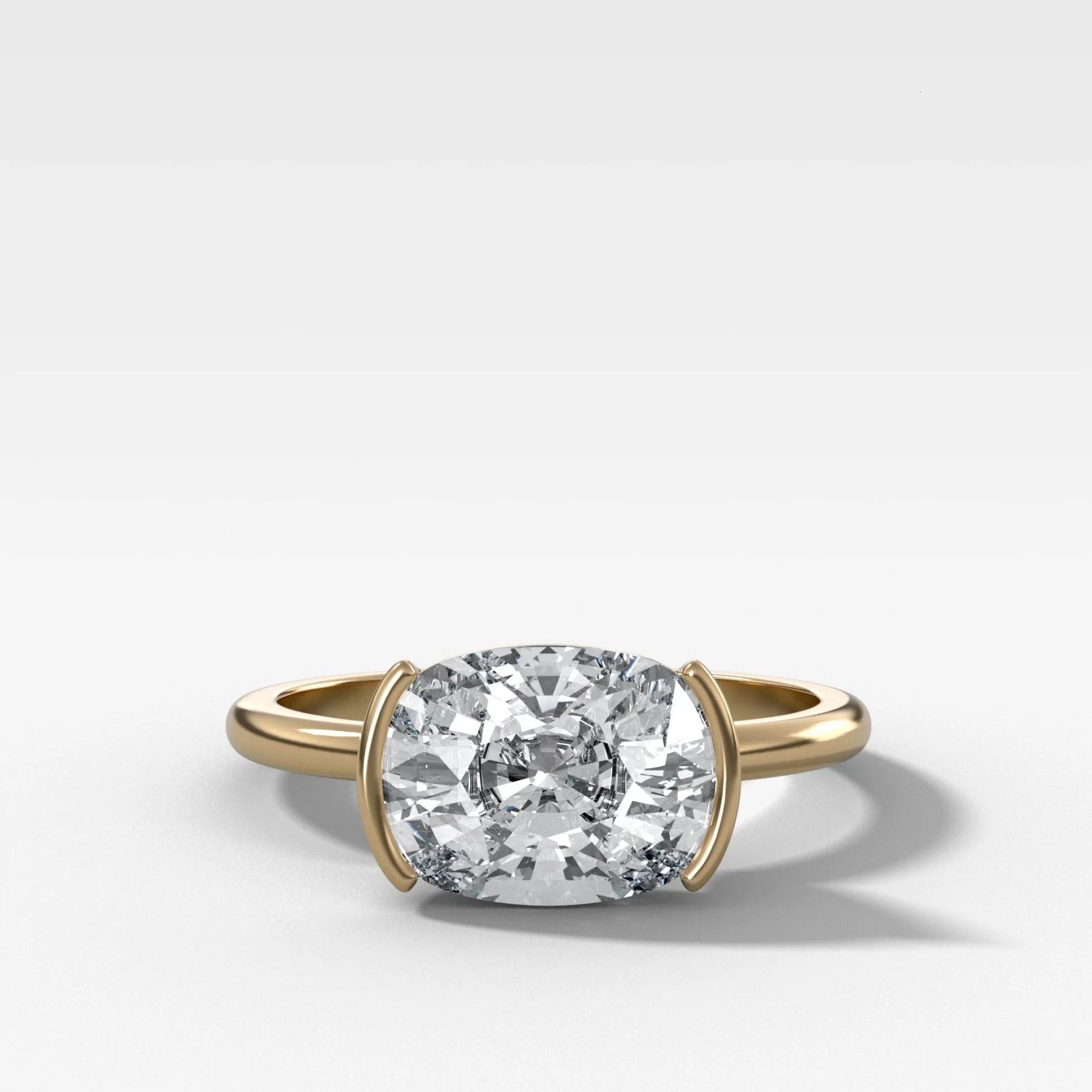East West Half Bezel Solitaire Engagement Ring With Elongated Cushion Cut Diamond
