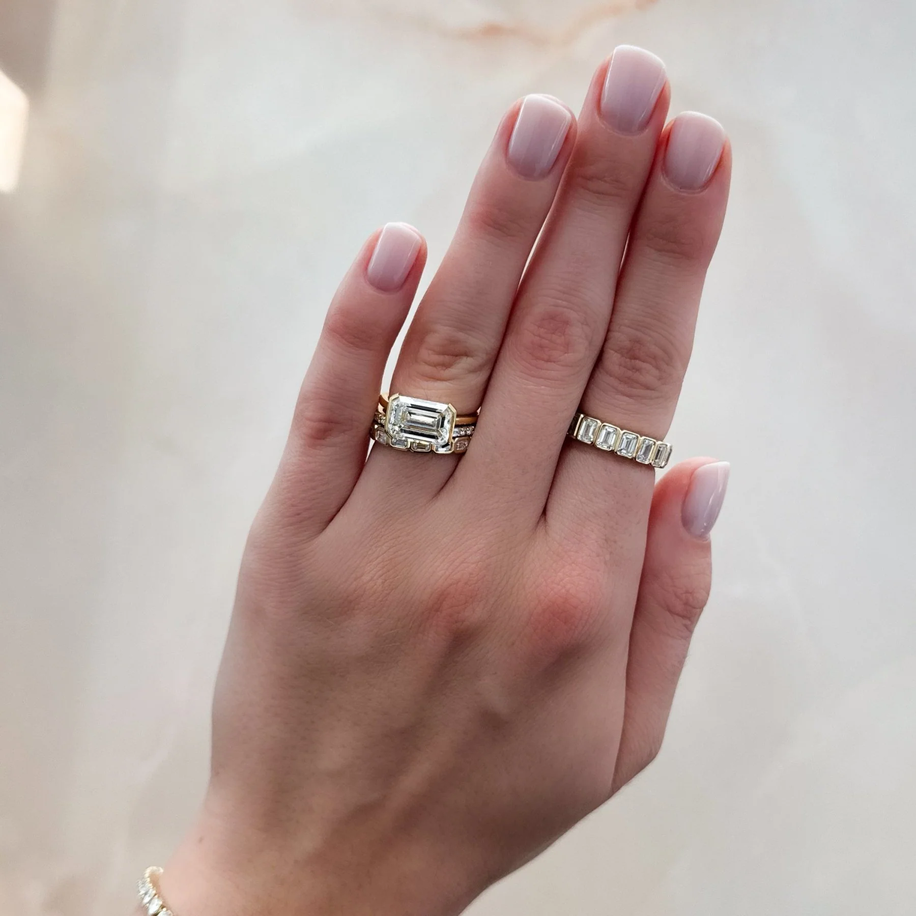 East West Half Bezel Solitaire Engagement Ring With Emerald Cut Diamond - Image 9