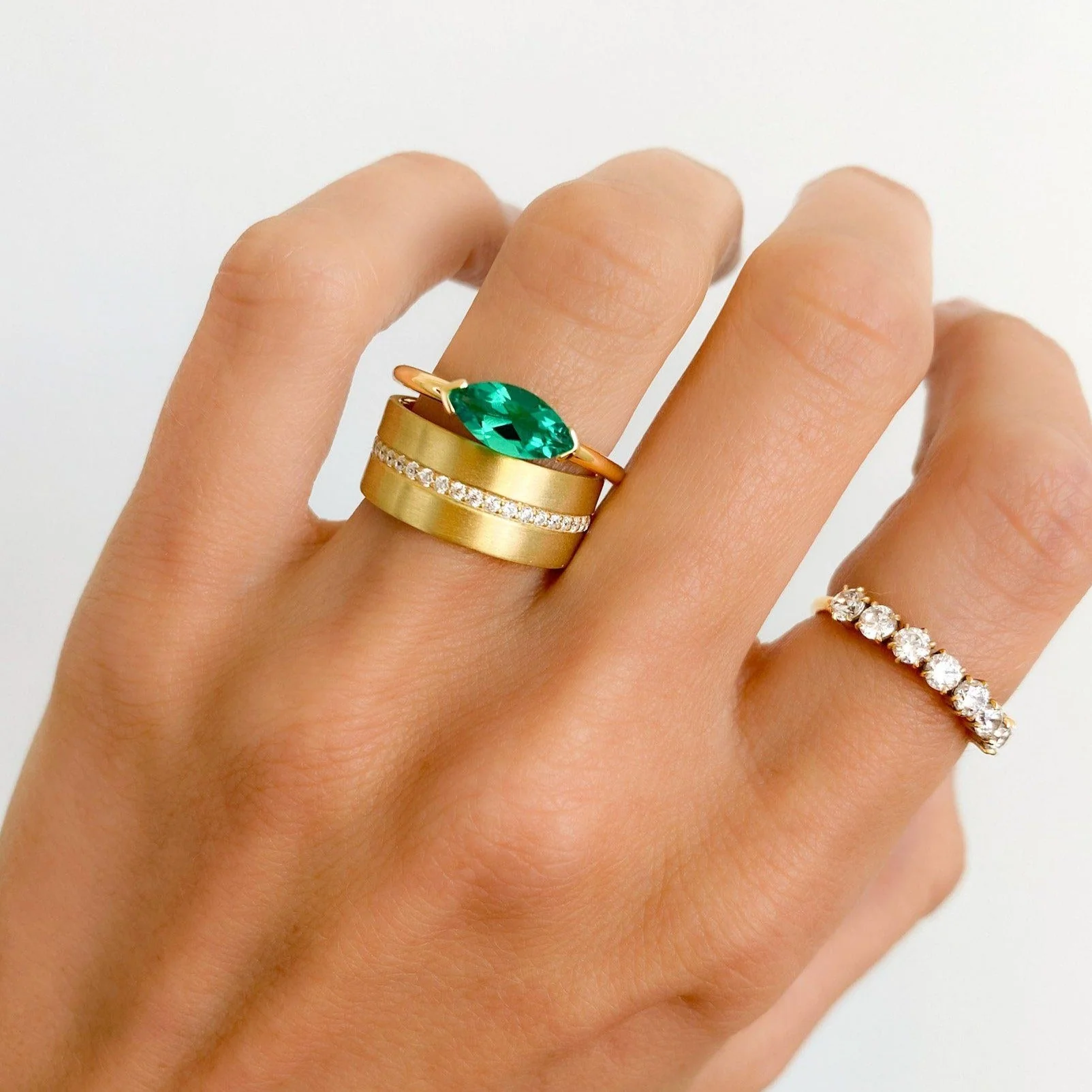 East West Half Bezel Solitaire Engagement Ring With Marquise Cut Green Emerald - Image 2