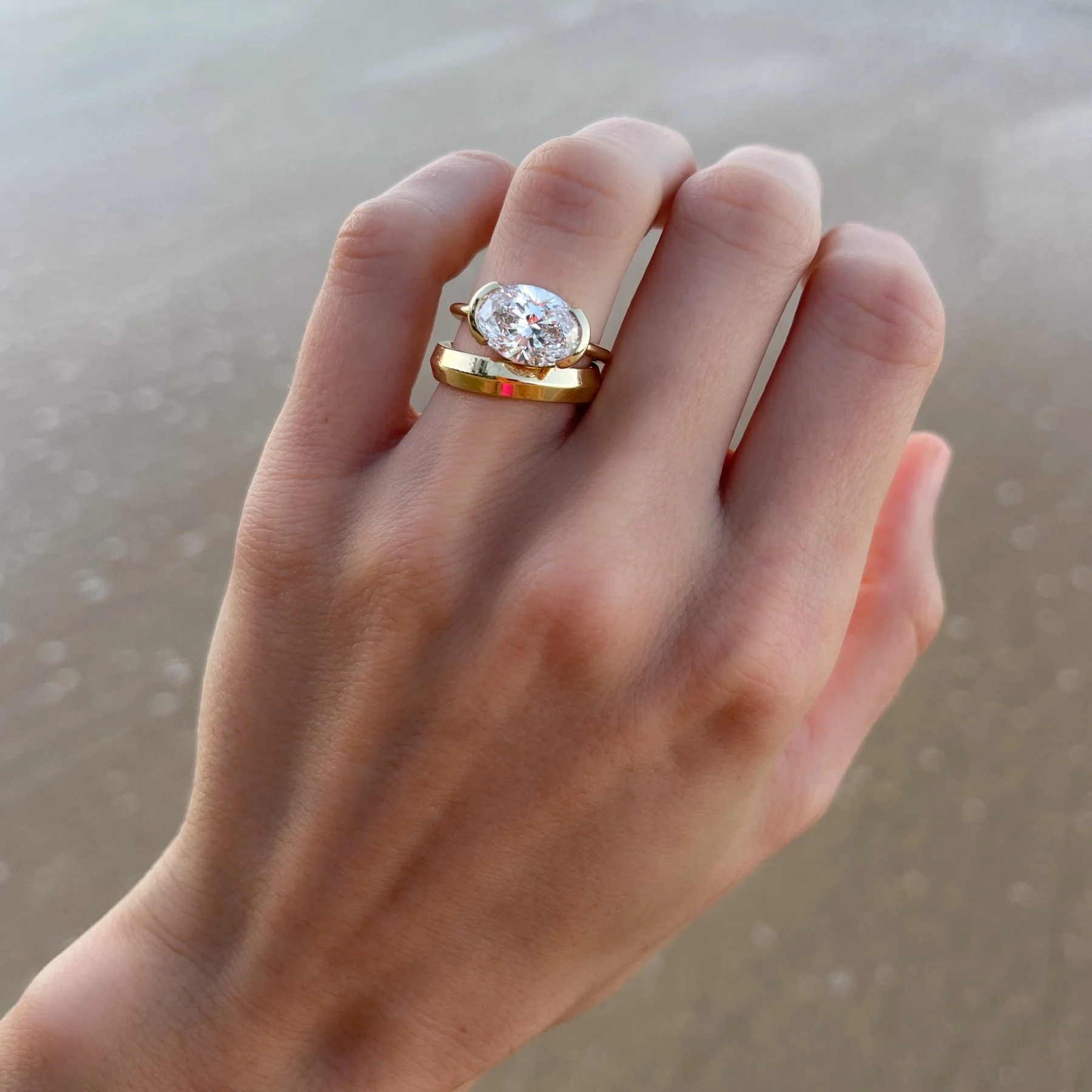 East West Half Bezel Solitaire Engagement Ring With Oval Cut Diamond - Image 10