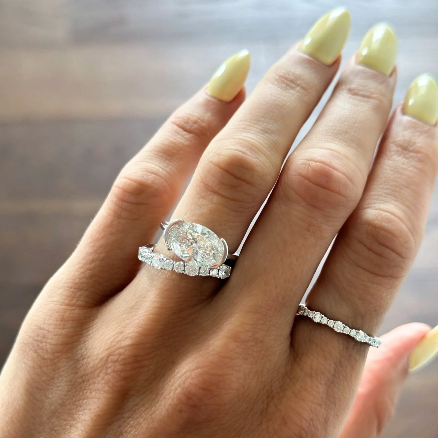 East West Half Bezel Solitaire Engagement Ring With Oval Cut Diamond - Image 5