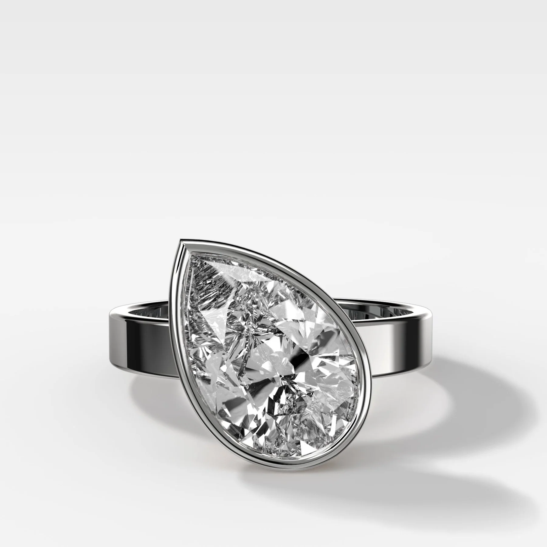 Finest Bezel Set Engagement Ring With Tilted Pear - Image 3