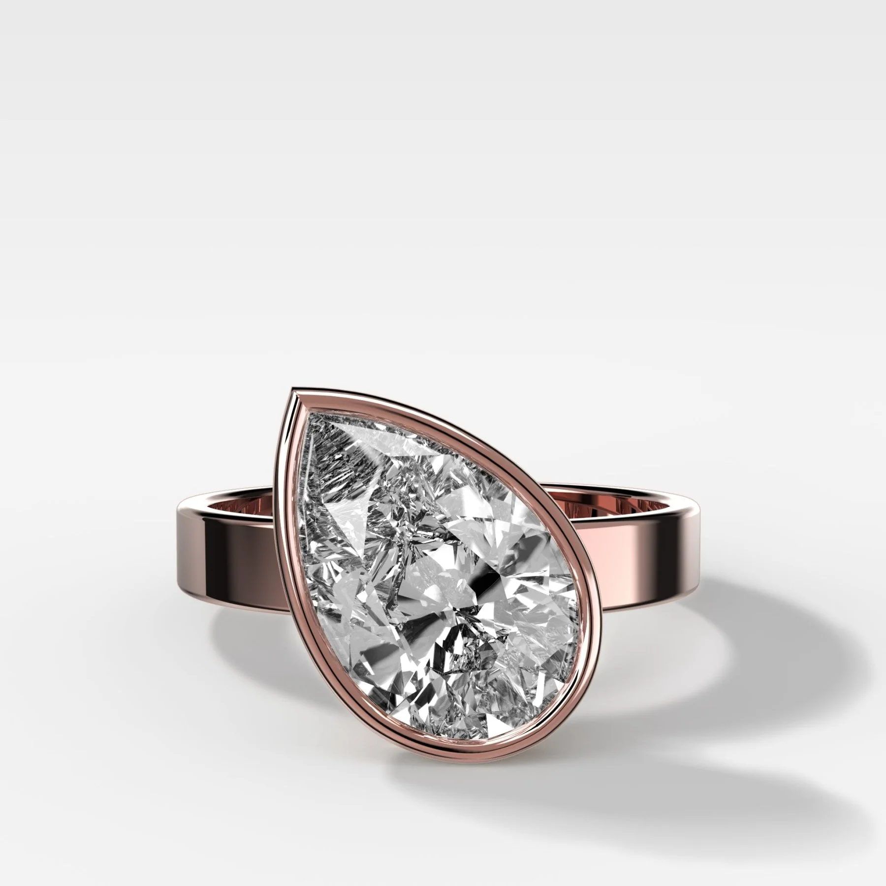 Finest Bezel Set Engagement Ring With Tilted Pear - Image 4