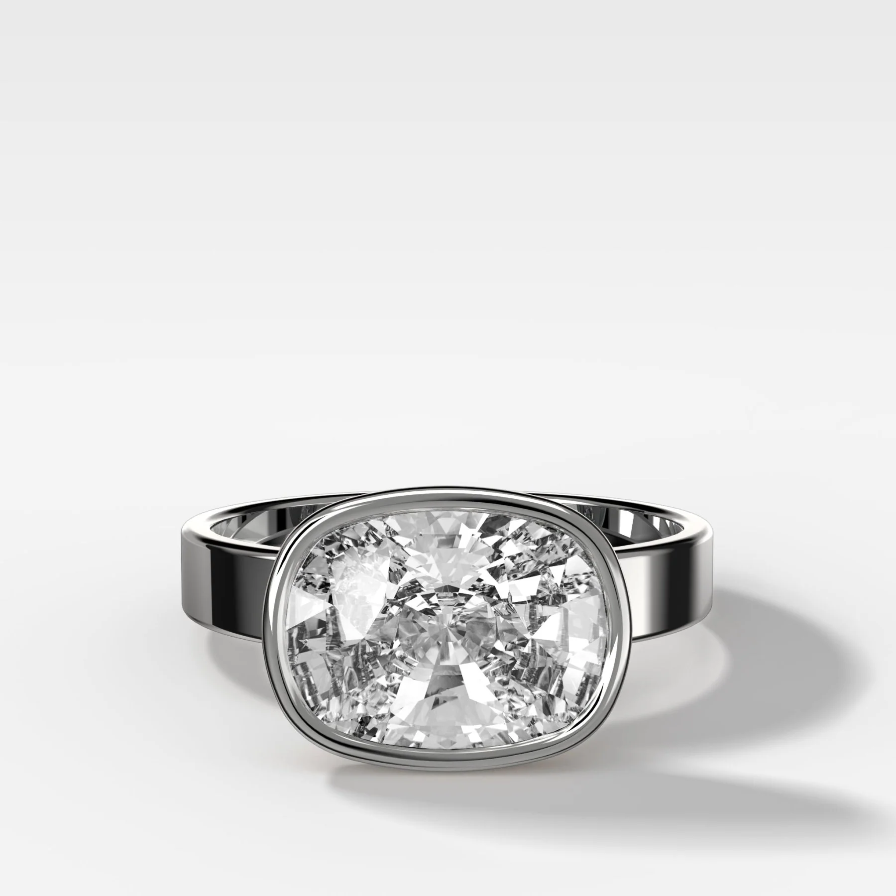 Finest Bezel Set Engagement Ring With East West Elongated Cushion Cut Diamond - Image 3