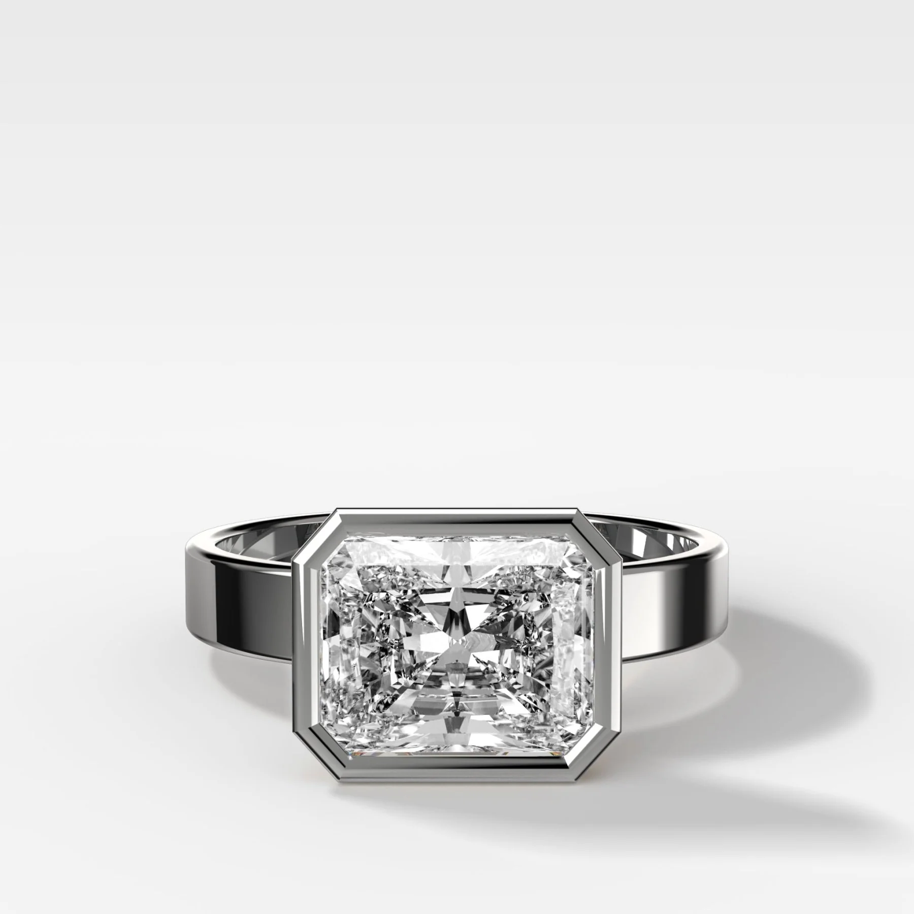Finest Bezel Set Engagement Ring With East West Elongated Radiant Cut Diamond - Image 3
