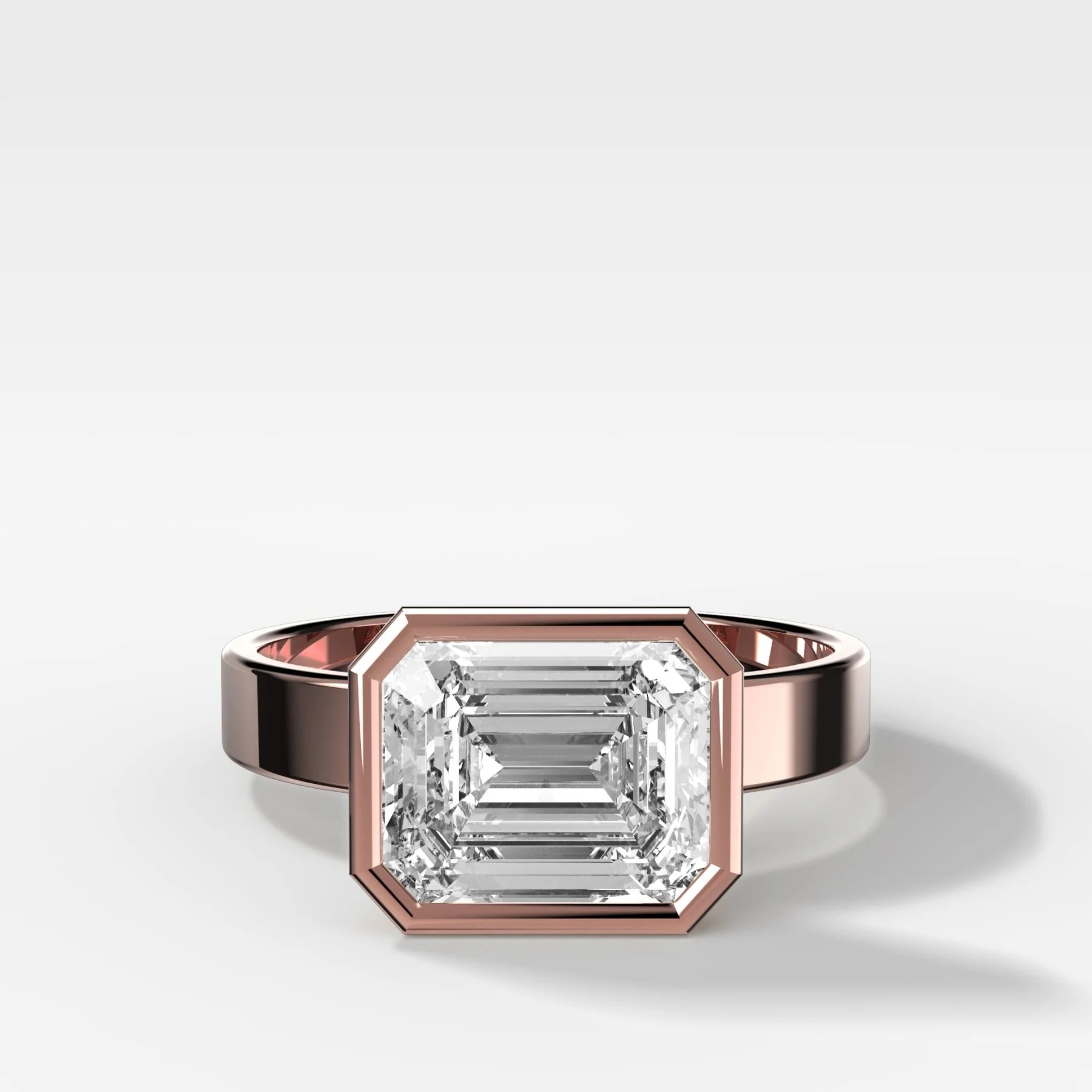 Finest Bezel Set Engagement Ring With East West Emerald Cut Diamond - Image 4