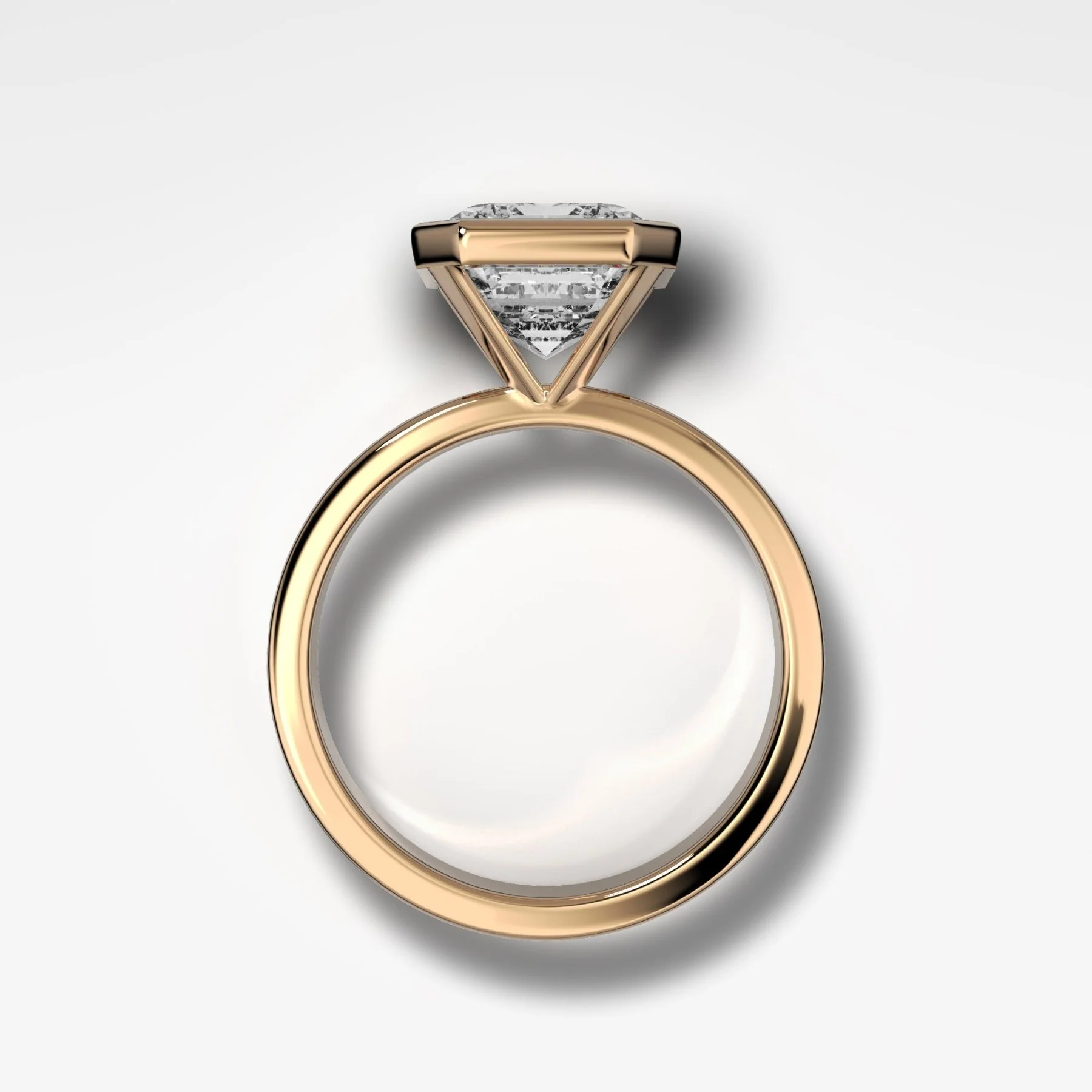 Finest Bezel Set Engagement Ring With Emerald Cut Diamond - Image 2
