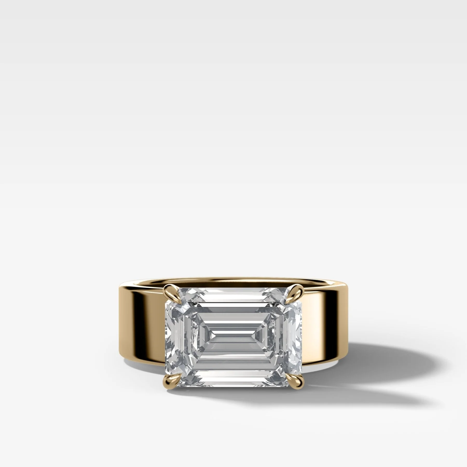 Finest Cigar Band Engagement Ring with East West Emerald Cut Diamond