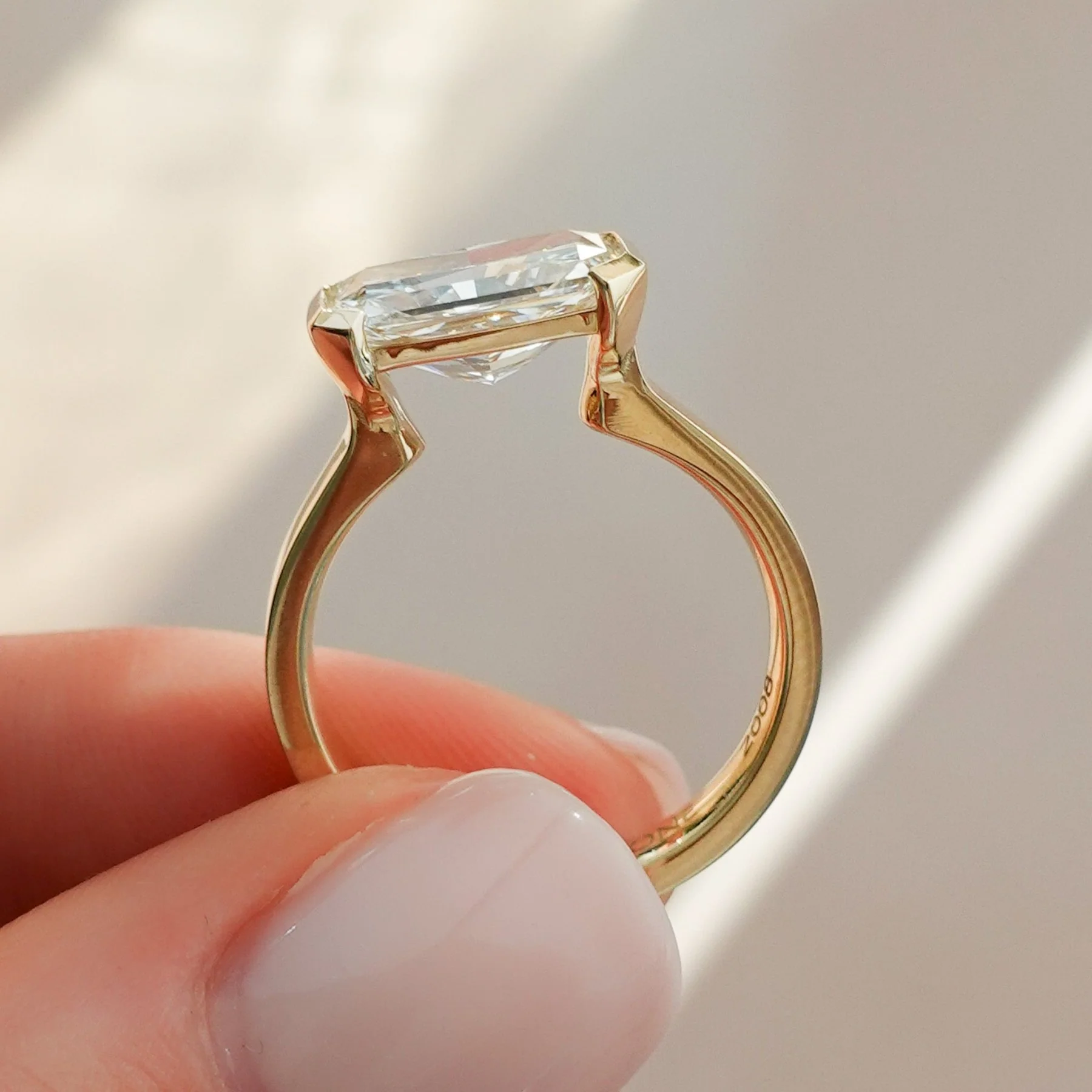 Finest Half Bezel Solitaire Engagement Ring With East West Elongated Radiant Cut Diamond - Image 2