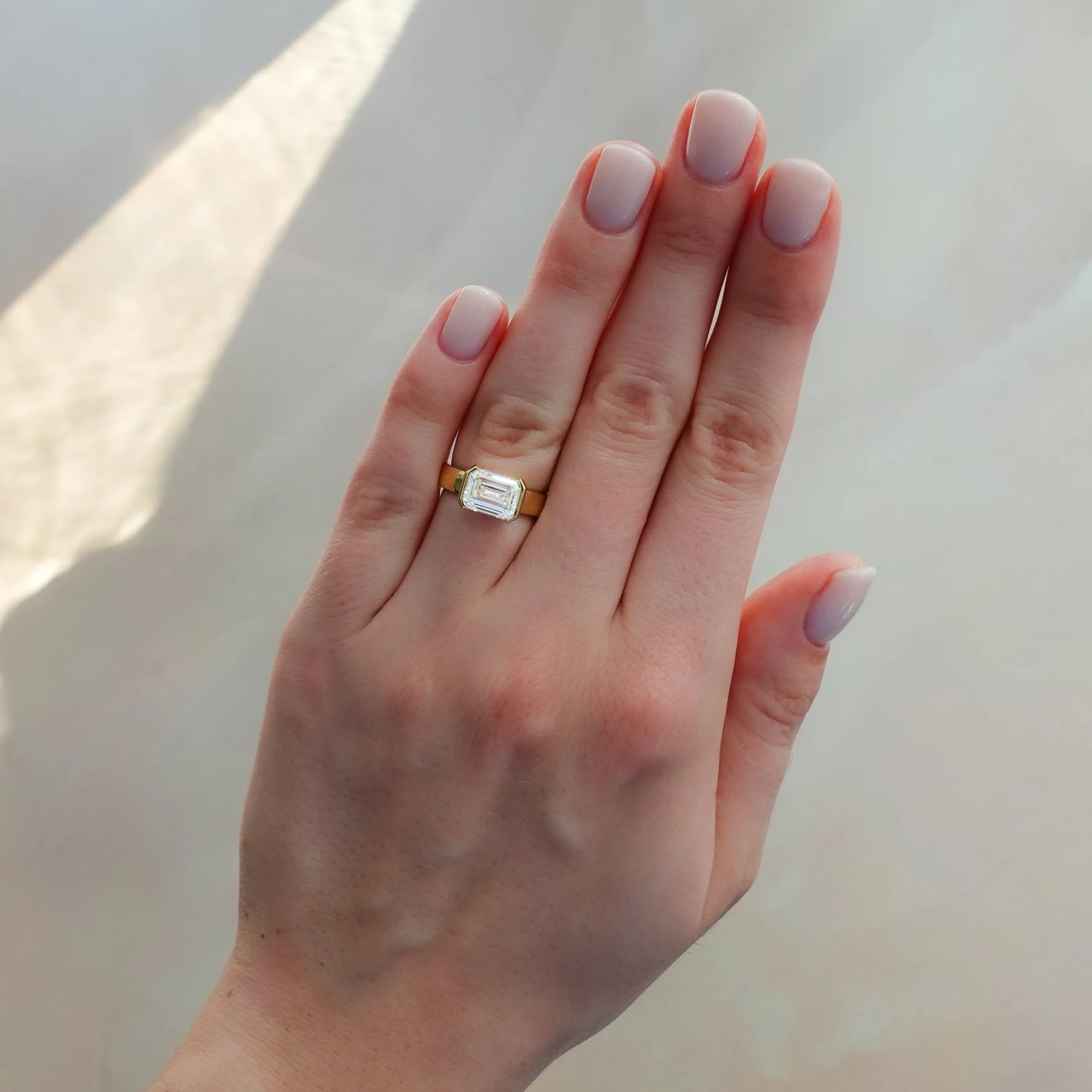 Finest Half Bezel Solitaire Engagement Ring With East West Emerald Cut Diamond - Image 3
