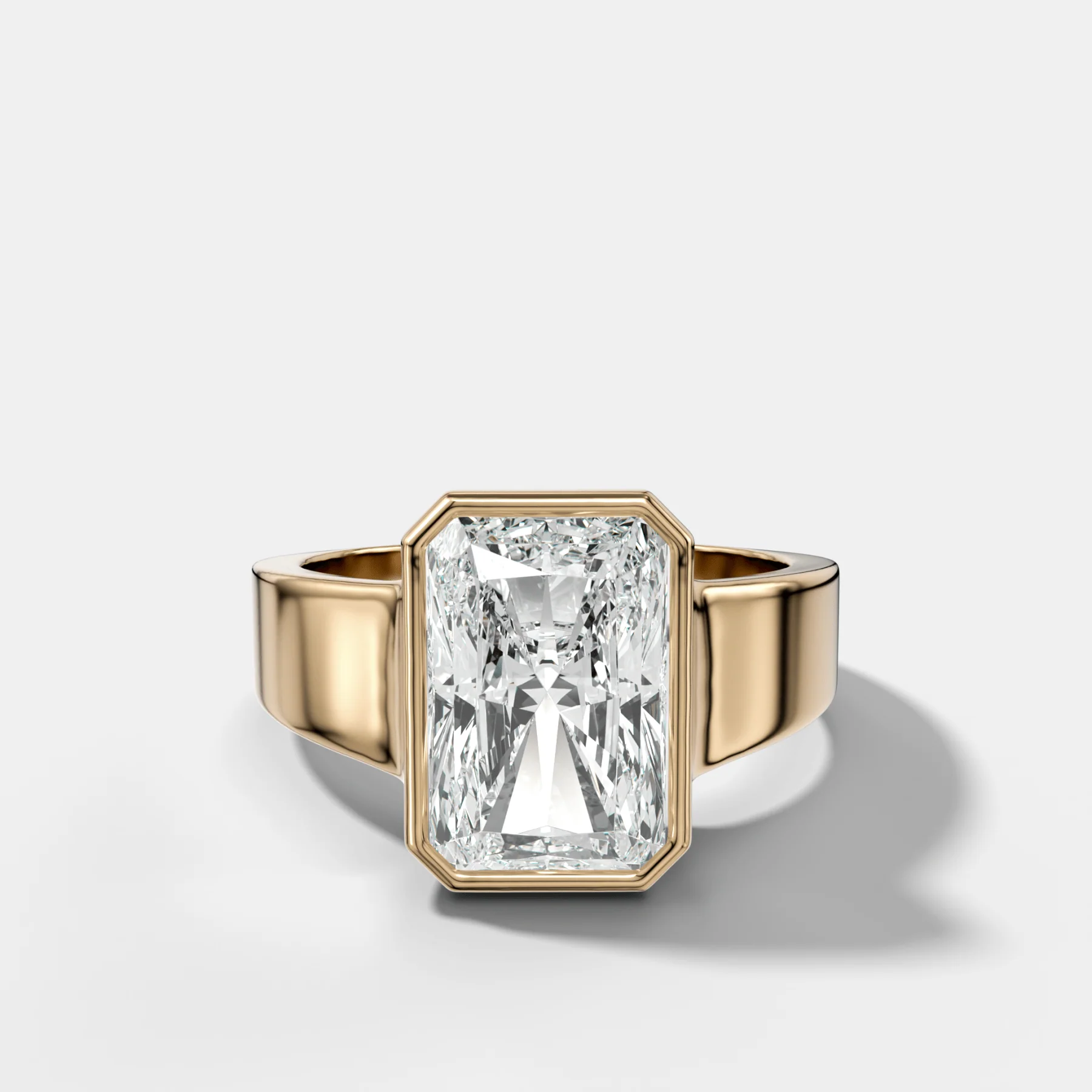 Finest Tapered Bezel Set Engagement Ring With Elongated Radiant Cut Diamond