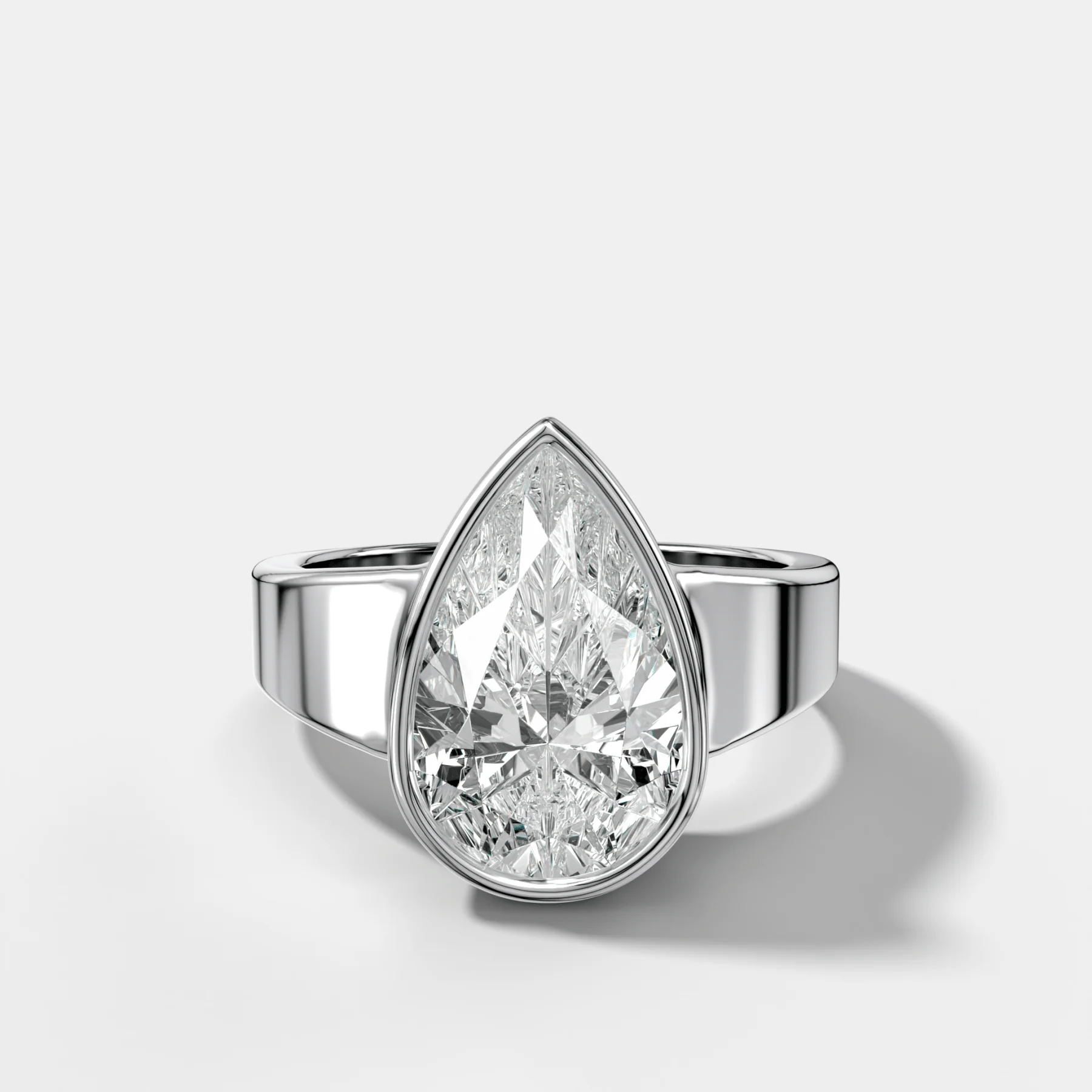 Finest Tapered Bezel Set Engagement Ring With Pear Cut Diamond - Image 3