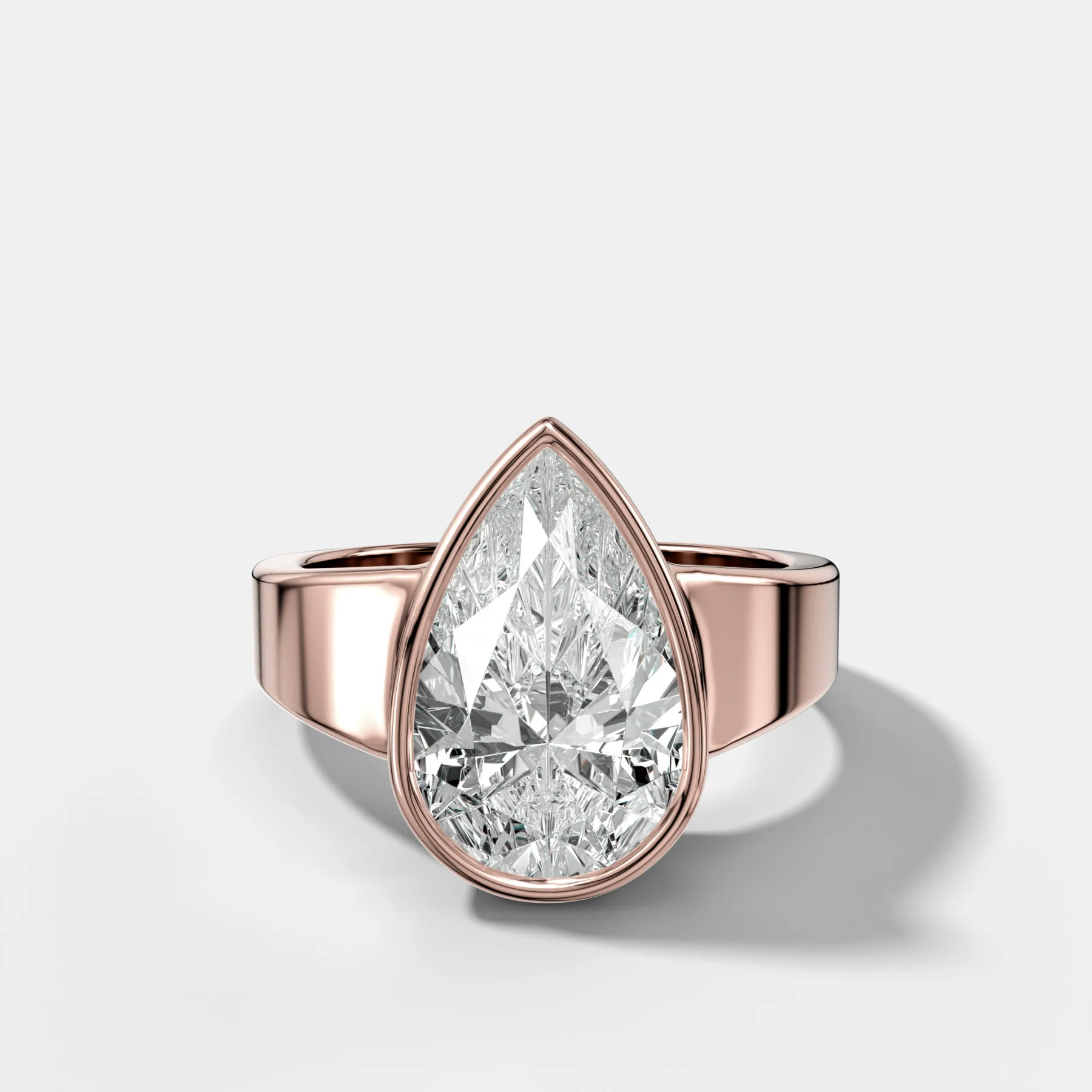 Finest Tapered Bezel Set Engagement Ring With Pear Cut Diamond - Image 4