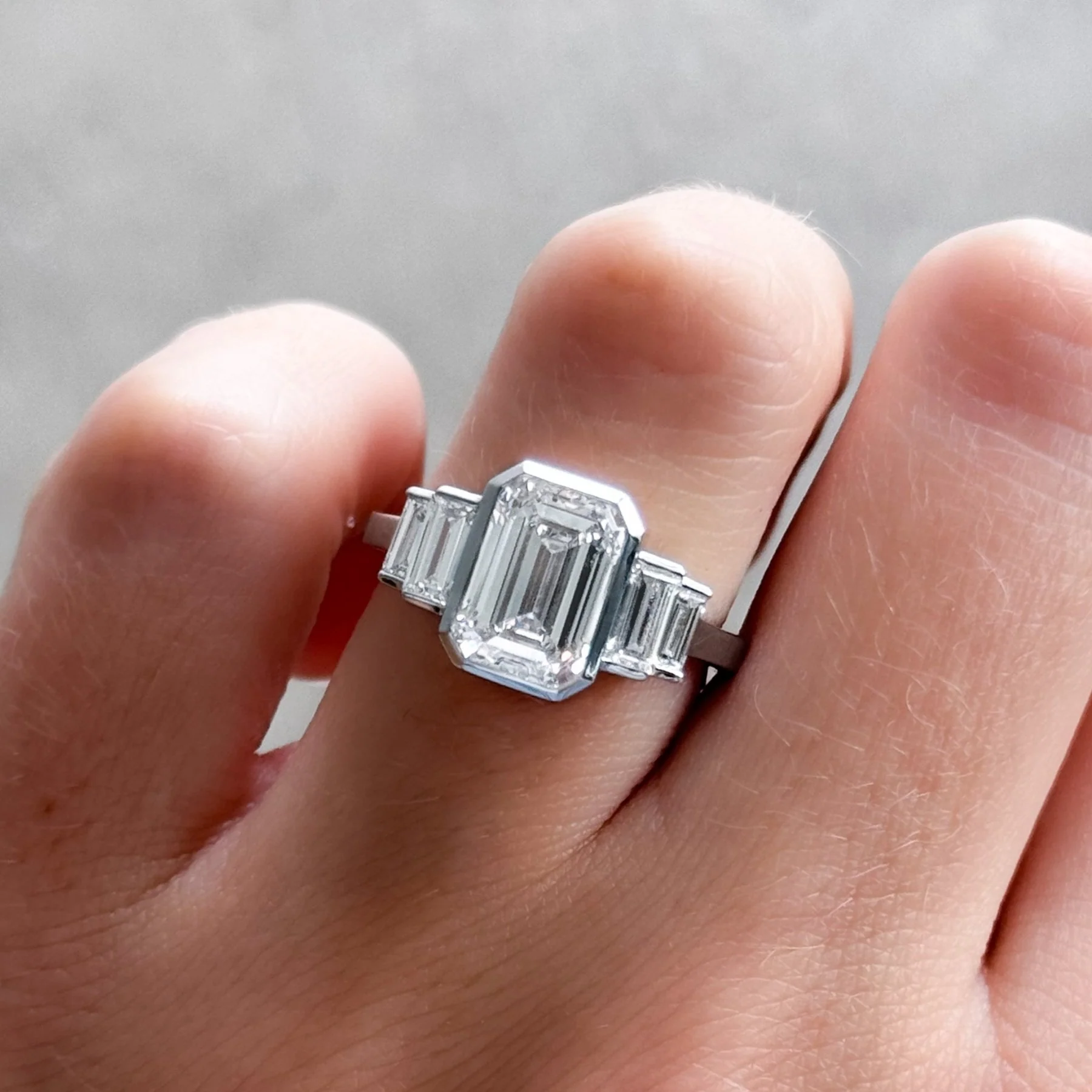 Five Stone Engagement Ring with Half Bezel Baguette Side Stones and Bezel Set Emerald Cut Diamond - Image 6