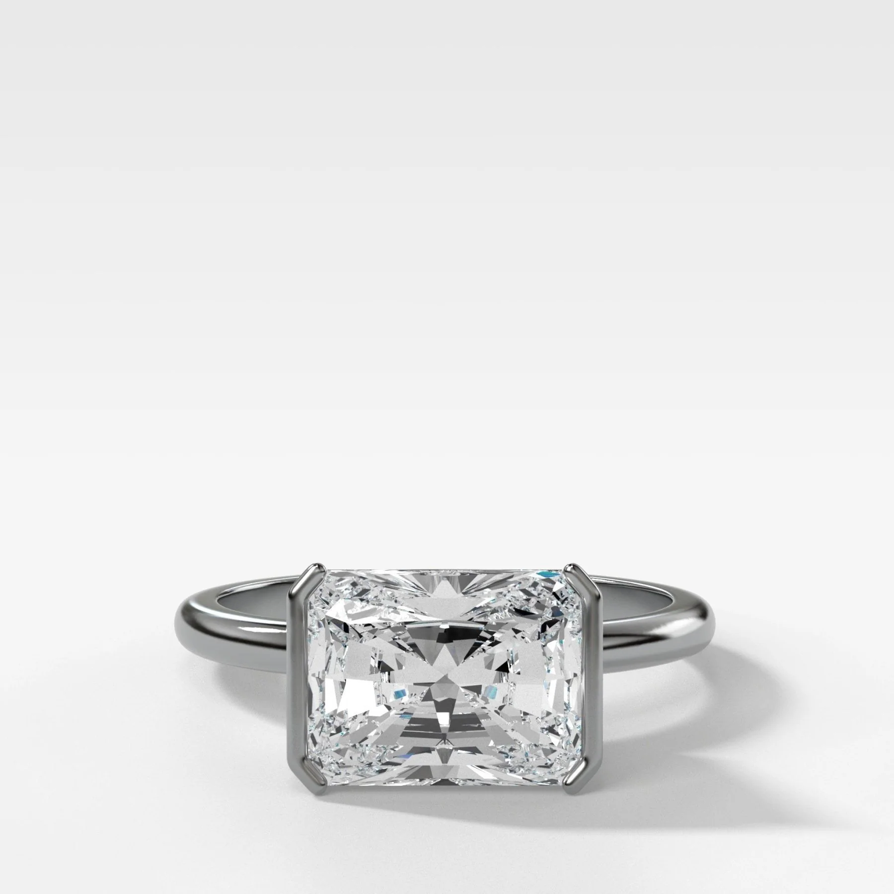 East West Half Bezel Solitaire Engagement Ring With Elongated Radiant Cut Diamond - Image 5