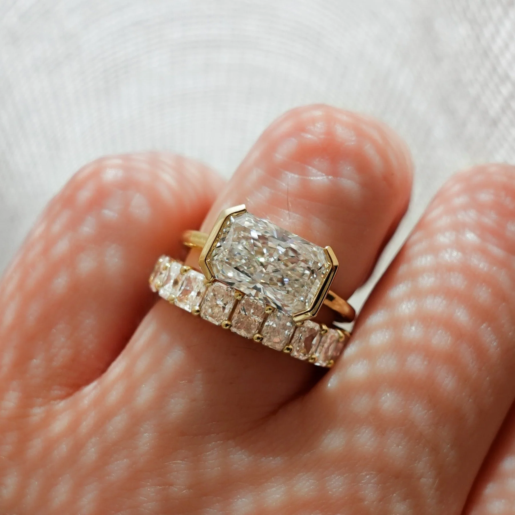 East West Half Bezel Solitaire Engagement Ring With Elongated Radiant Cut Diamond - Image 8