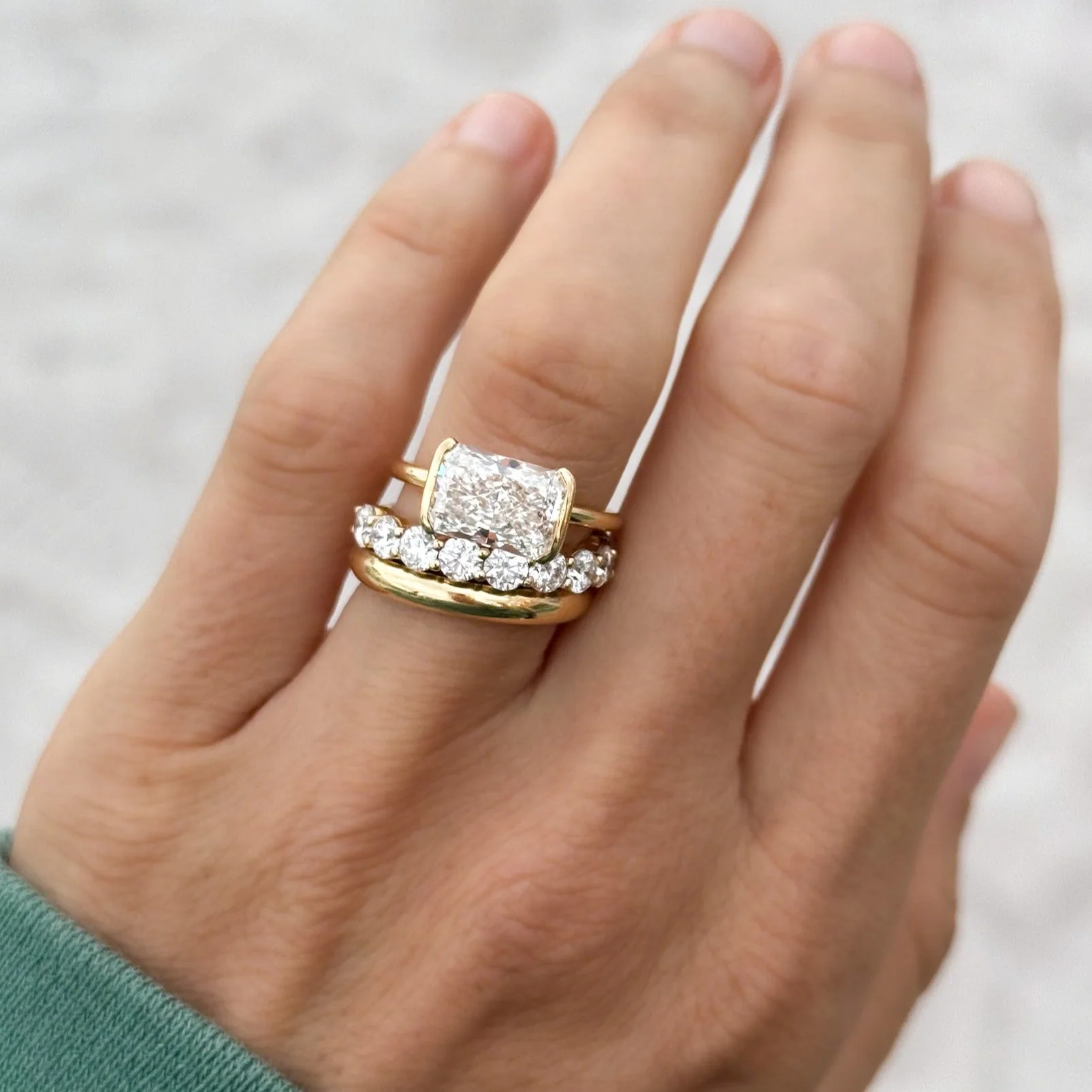 East West Half Bezel Solitaire Engagement Ring With Elongated Radiant Cut Diamond - Image 9
