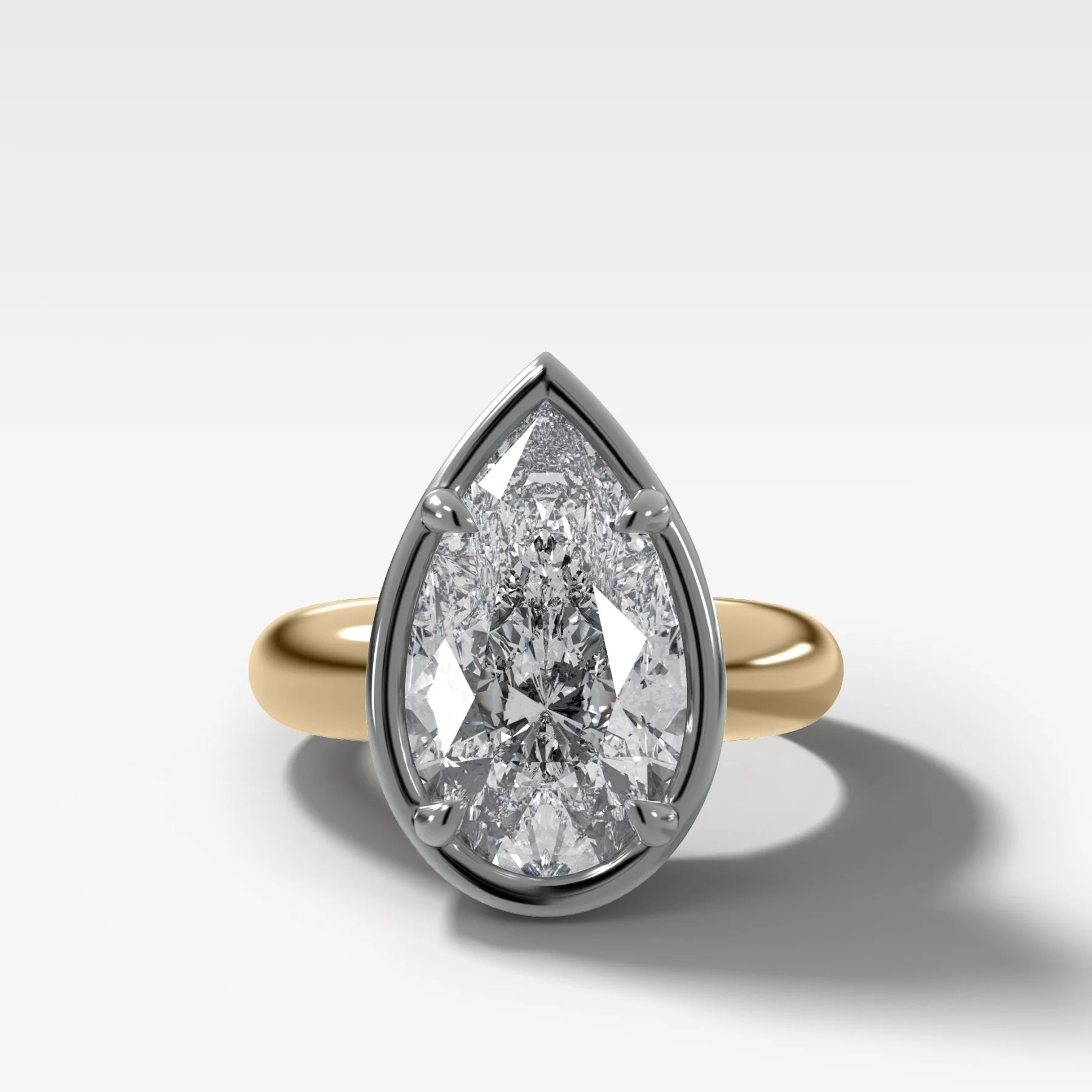 Mixed Metal Club Ring Solitaire Engagement Ring With a Pear Cut Diamond