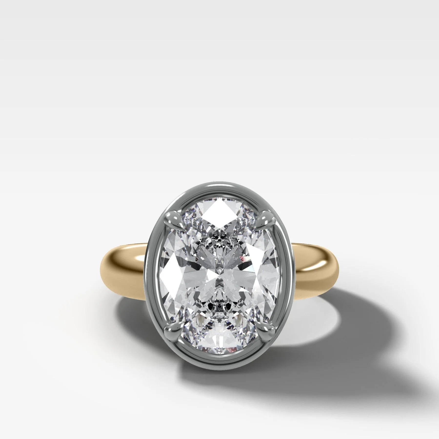 Mixed Metal Club Ring Solitaire Engagement Ring With an Oval Cut Diamond