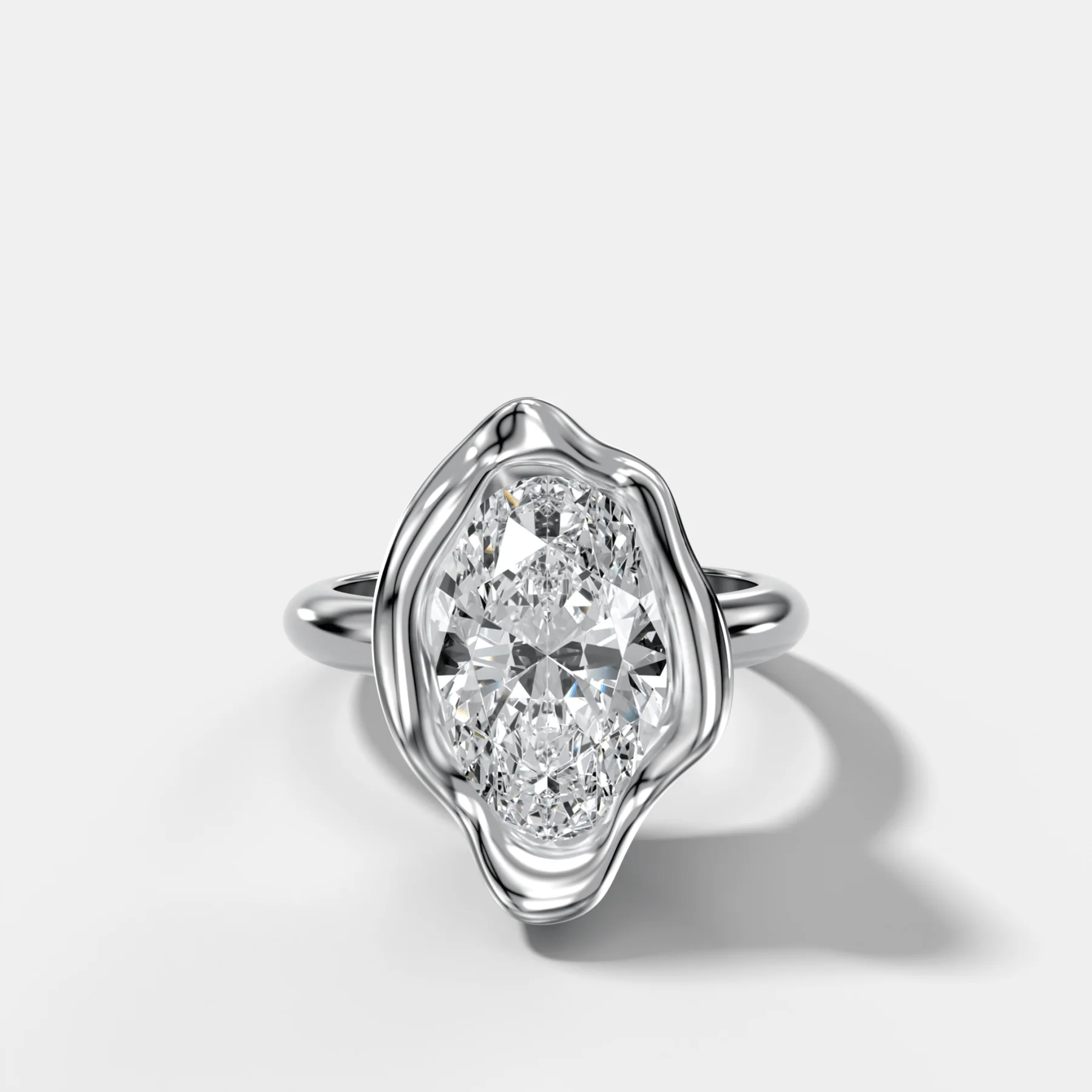 Molten Bezel Engagement Ring With an Oval Cut Diamond - Image 3