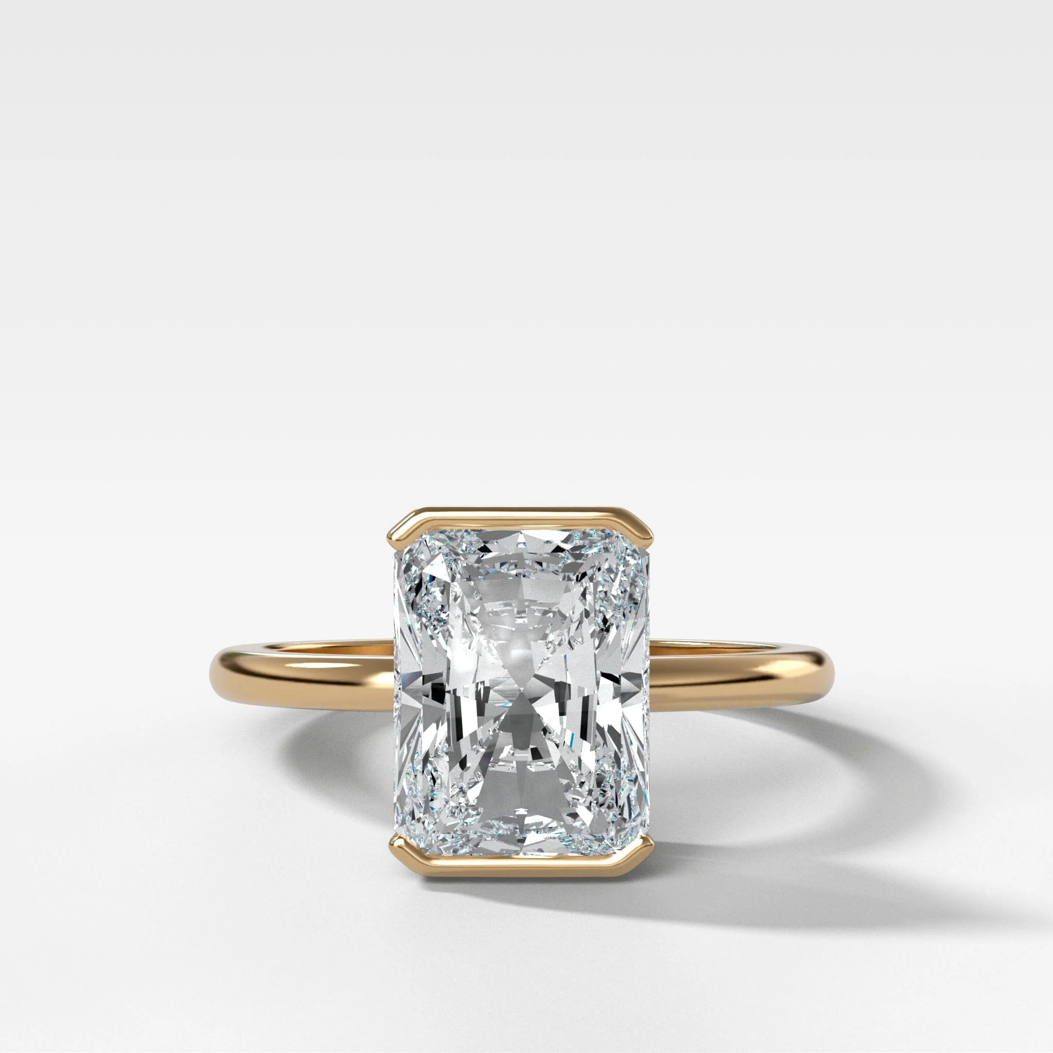 North South Half Bezel Solitaire Engagement Ring With Elongated Radiant Cut Diamond