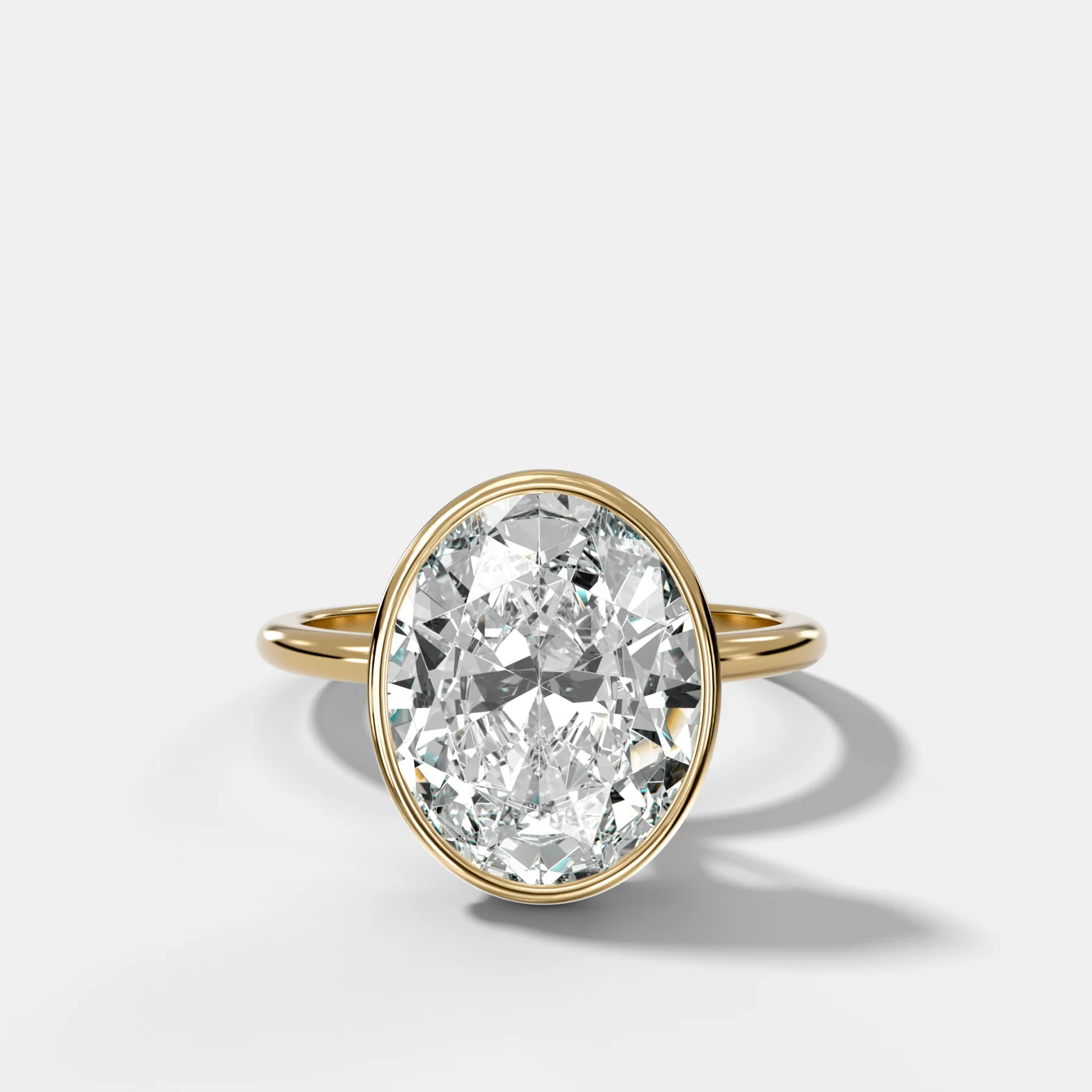 Penumbra Bezel Hidden Halo Engagement Ring with Oval Cut