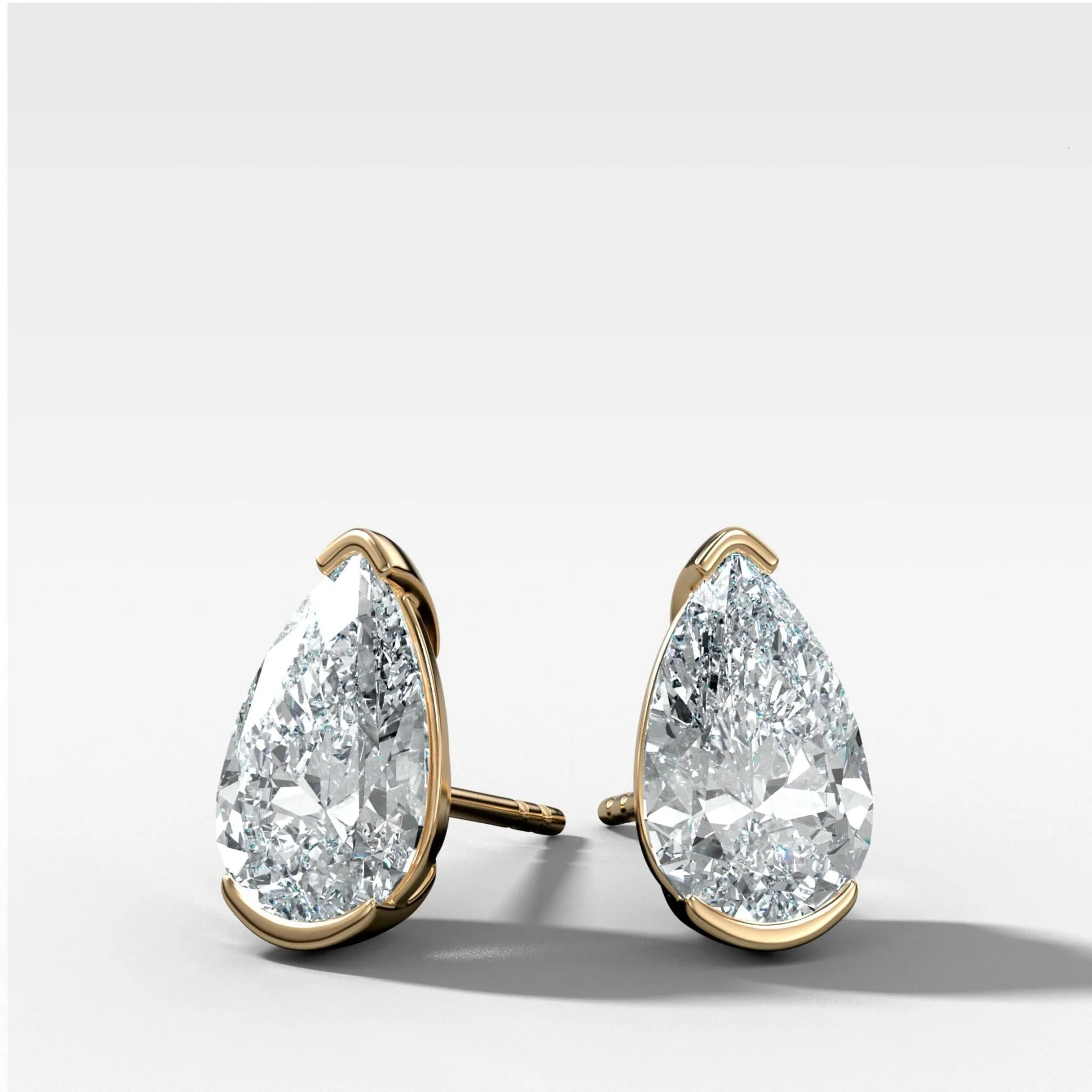 Pear Cut Half Bezel Diamond Studs