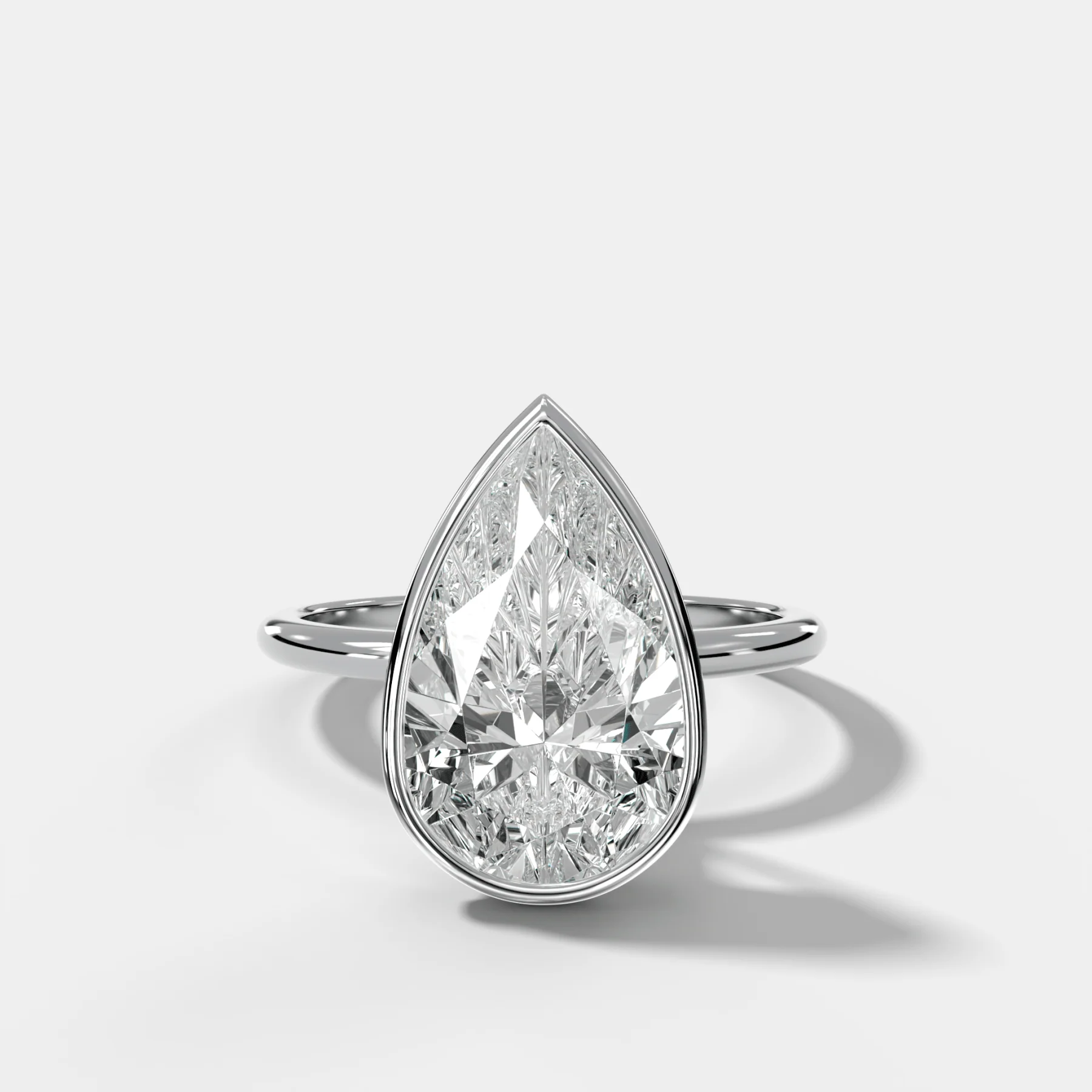 Penumbra Bezel Hidden Halo Engagement Ring with Pear Cut - Image 3