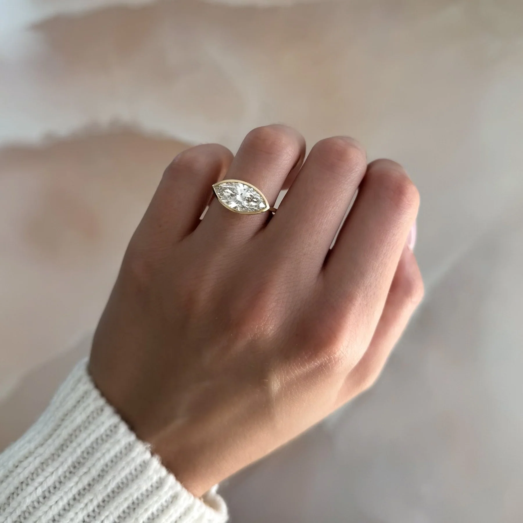 Penumbra Bezel Set Engagement Ring With East West Marquise Cut - Image 3
