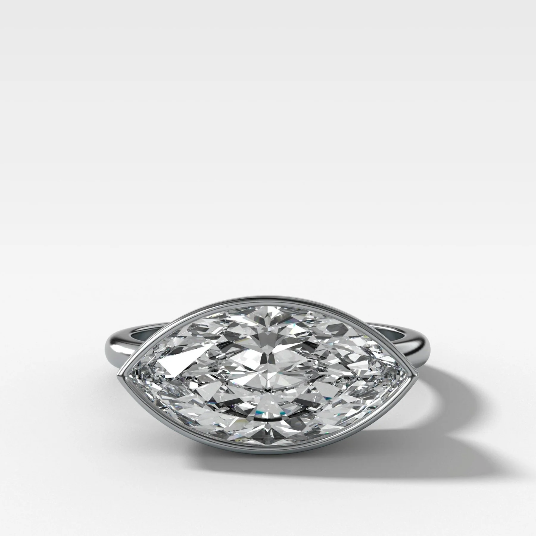 Penumbra Bezel Set Engagement Ring With East West Marquise Cut - Image 4