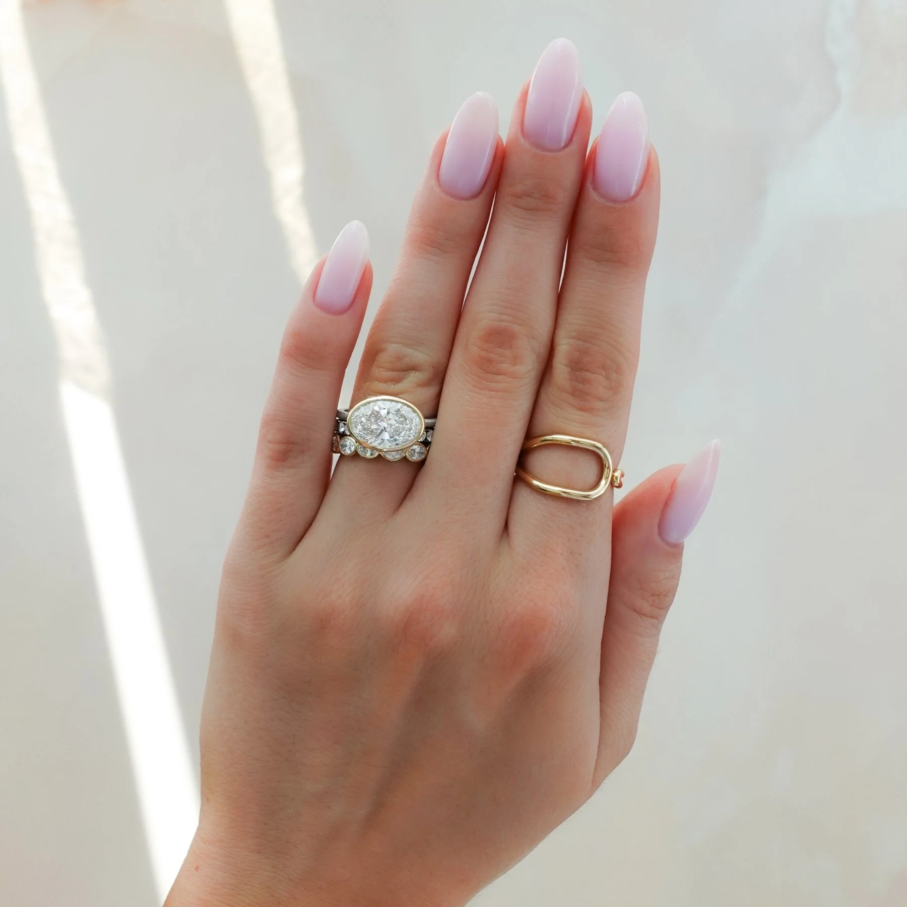 Penumbra Bezel Set Engagement Ring With East West Oval Cut - Image 6