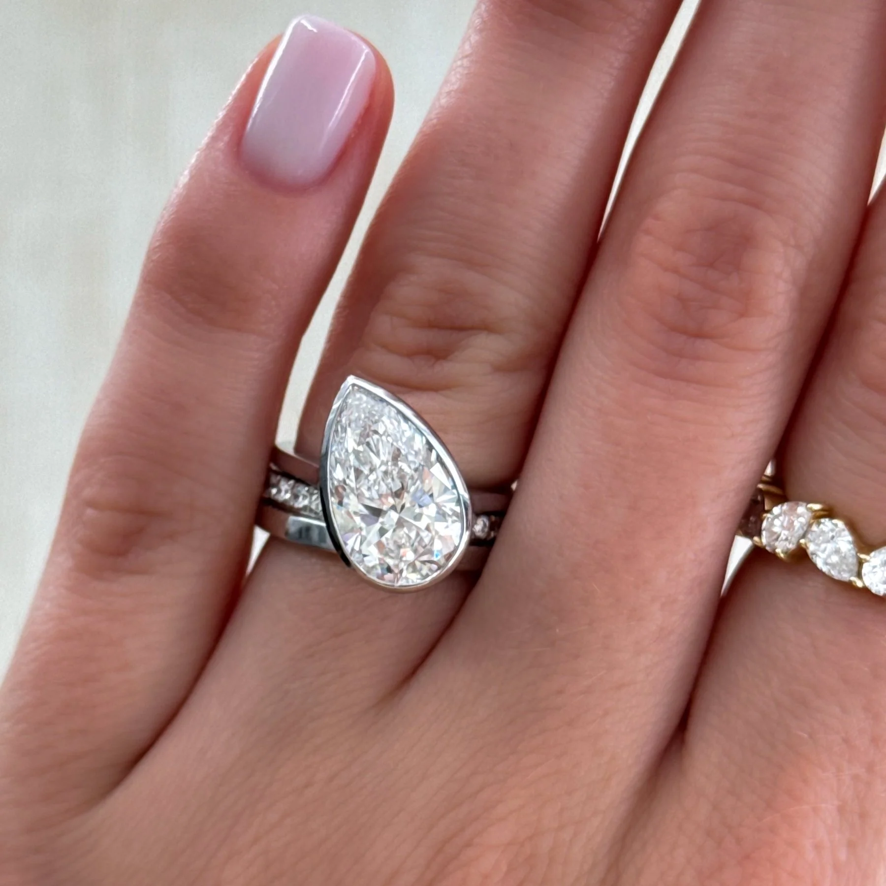 Penumbra Bezel Set Engagement Ring With Tilted Pear Cut - Image 10