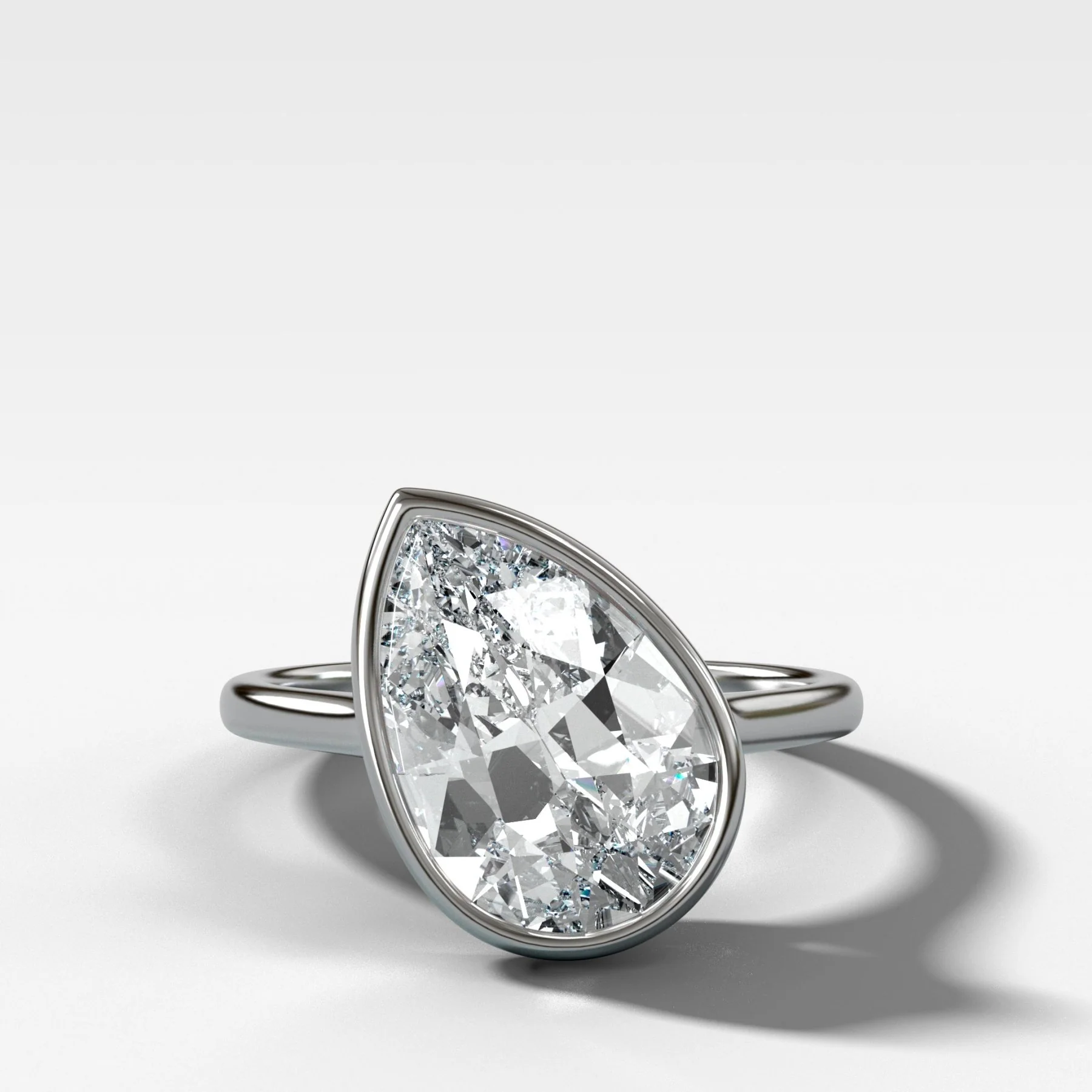 Penumbra Bezel Set Engagement Ring With Tilted Pear Cut - Image 4