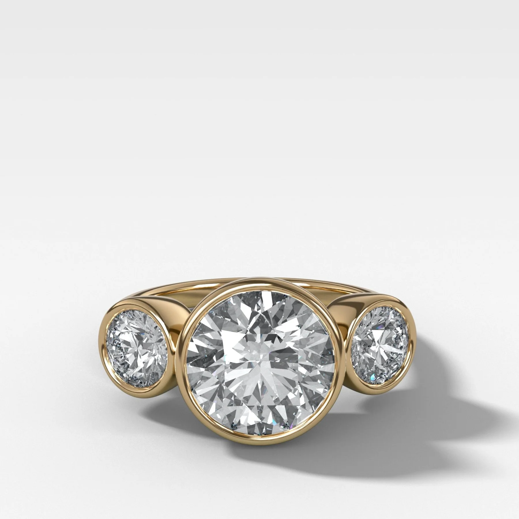 Penumbra Bezel Triad Engagement Ring With 3.14ct Lab Grown Round Cut Diamond