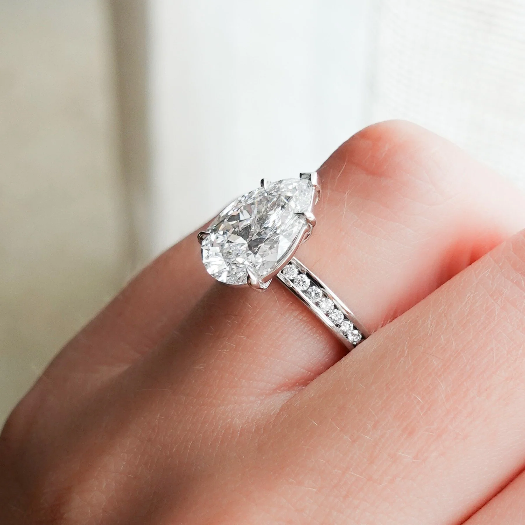 Petite Channel Set Engagement Ring with Pear Cut Diamond - Image 7