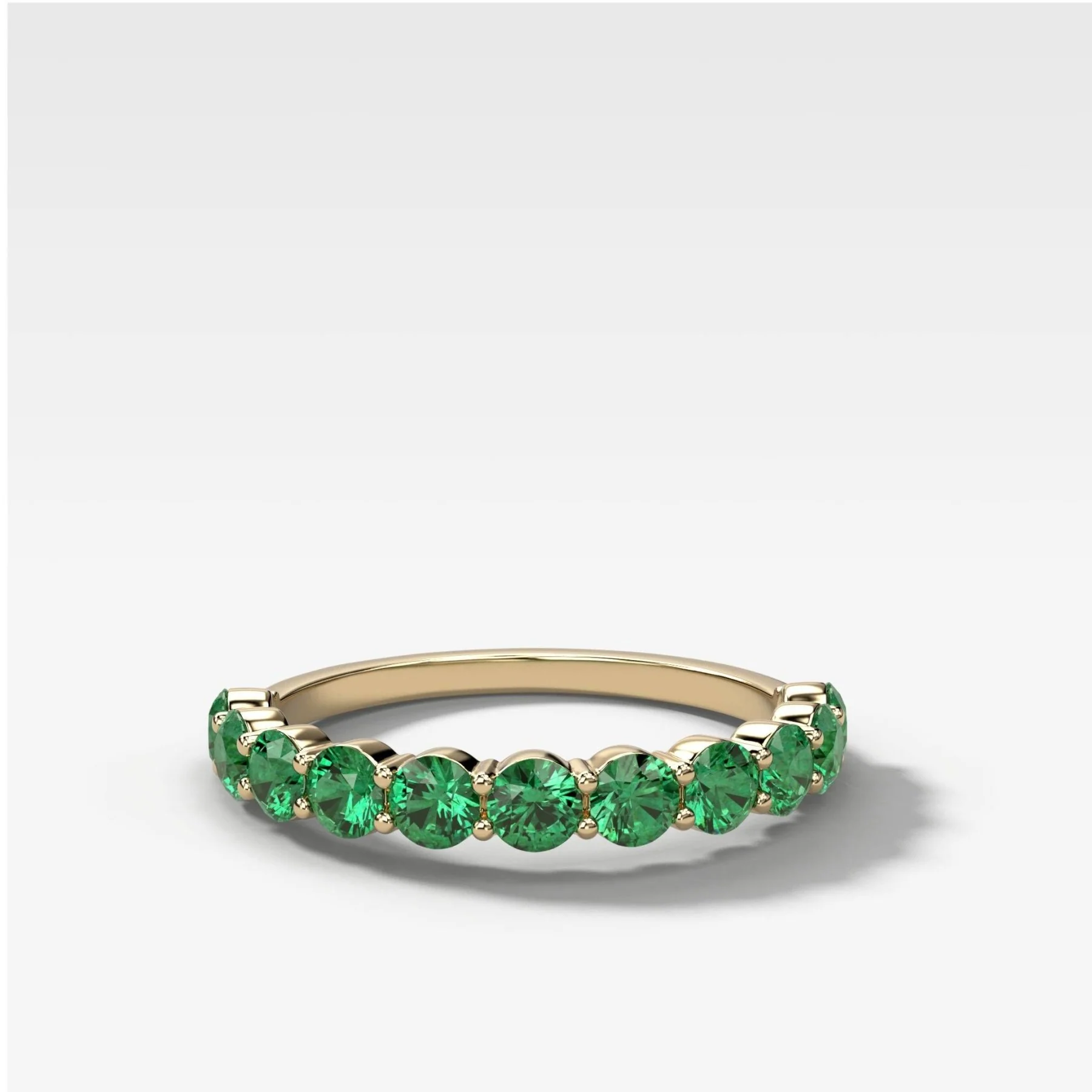 Shared Prong Wedding Band With Green Emeralds